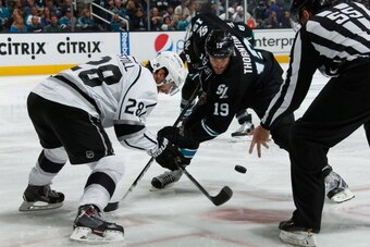 SAN JOSE, CA - APRIL 26: Joe Thornton #19 of the San Jose Sharks takes a face-off against Jarret Stoll #28 of the Los Angeles Kings in Game Five of the First Round of the 2014 Stanley Cup Playoffs at SAP Center on April 26, 2014 in San Jose, California. (