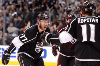 LOS ANGELES, CA - MAY 08:  Jeff Carter #77 of the Los Angeles Kings celebrates his goal with Anze Kopitar #11 and Drew Doughty #8 to make the score 1-1 during the second period in Game Three of the Second Round of the 2014 NHL Stanley Cup Playoffs at Stap