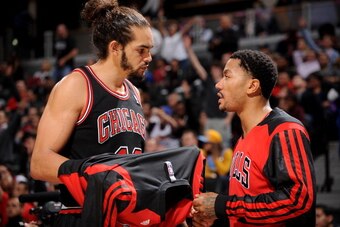 DENVER, CO - NOVEMBER 21:  Joakim Noah #13 and Derrick Rose #1 of the Chicago Bulls talk during the game against the Denver Nuggets on November 21, 2013 at the Pepsi Center in Denver, Colorado. NOTE TO USER: User expressly acknowledges and agrees that, by