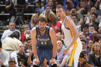 OAKLAND, CA - APRIL 14: Kevin Love #42 (left) of the Minnesota Timberwolves and David Lee #10 (right) of the Golden State Warriors during a game on April 14, 2014 at Oracle Arena in Oakland, California. NOTE TO USER: User expressly acknowledges and agrees