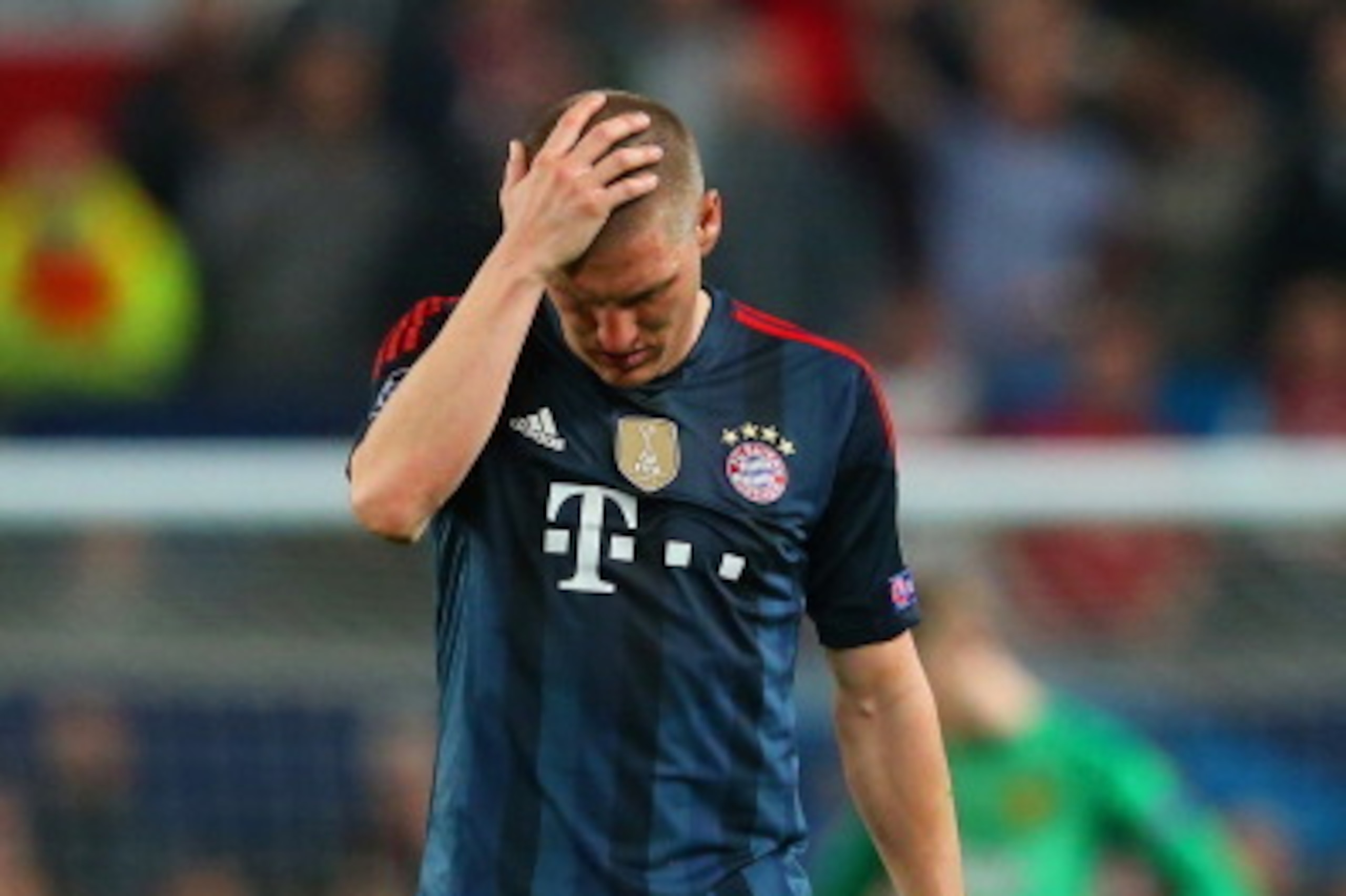 MANCHESTER, ENGLAND - APRIL 01:  A dejected Bastian Schweinsteiger of Bayern Muenchen holds his head after he was shown a red card during the UEFA Champions League Quarter Final first leg match between Manchester United and FC Bayern Muenchen at Old Traff