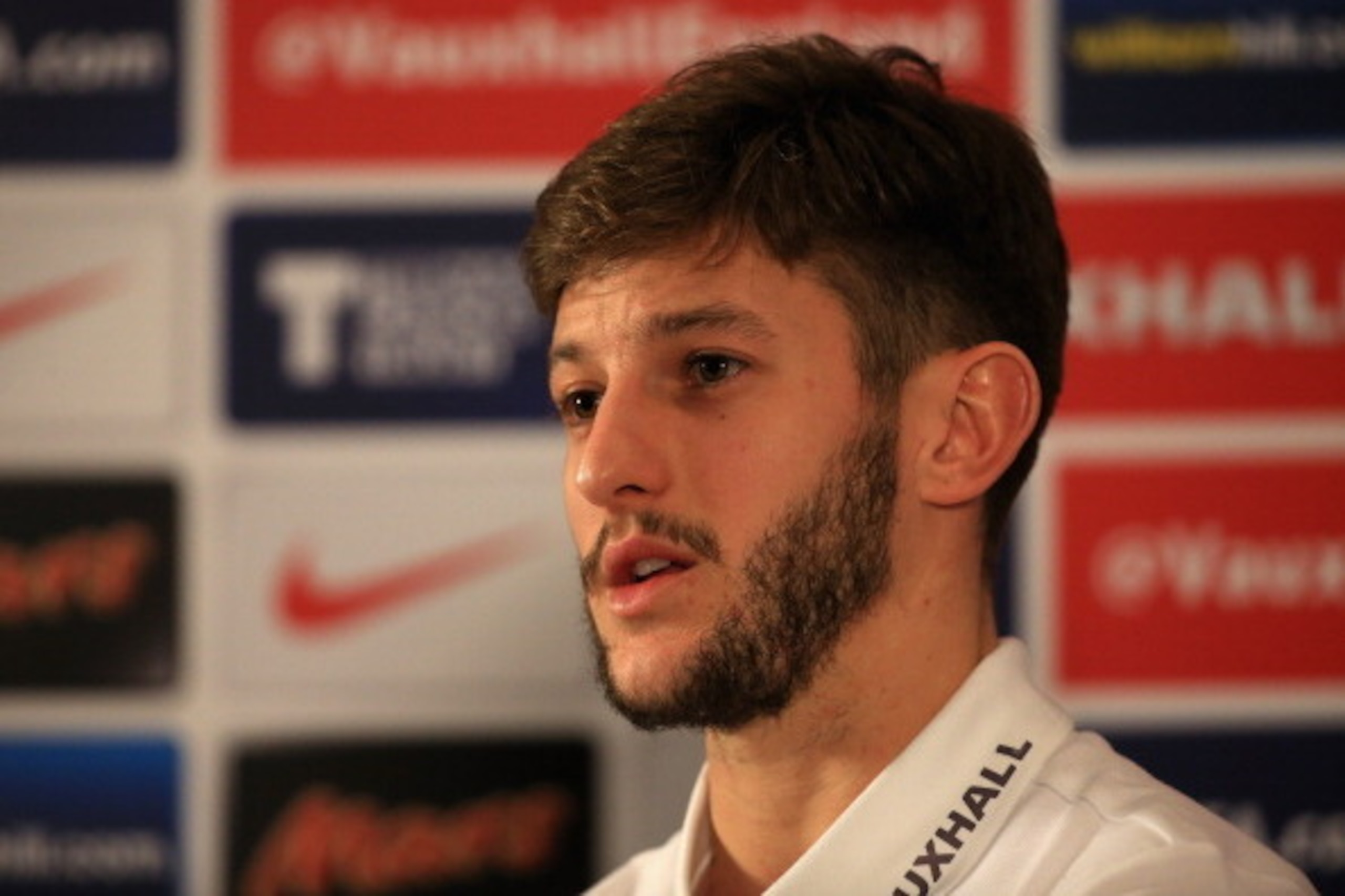 WATFORD, ENGLAND - MARCH 03:  Adam Lallana talks to the media during a press conference at The Grove hotel on March 3, 2014 in Watford, England.  (Photo by Richard Heathcote/Getty Images)