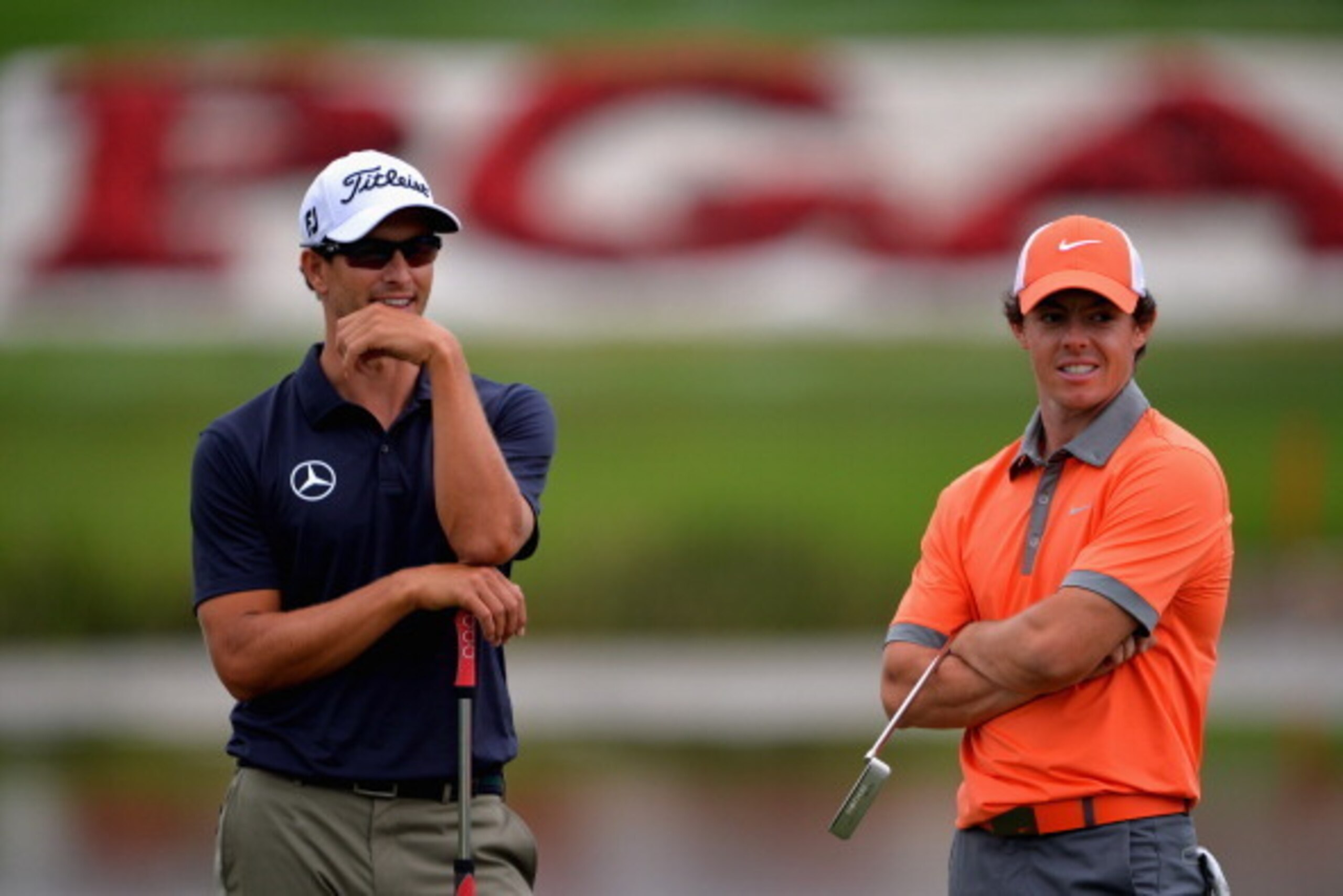 PALM BEACH GARDENS, FL - FEBRUARY 27:  Rory McIlroy of Northern Ireland (R) and Adam Scott of Australia talk to one another during the first round of The Honda Classic at PGA National Resort and Spa on February 27, 2014 in Palm Beach Gardens, Florida.  (P