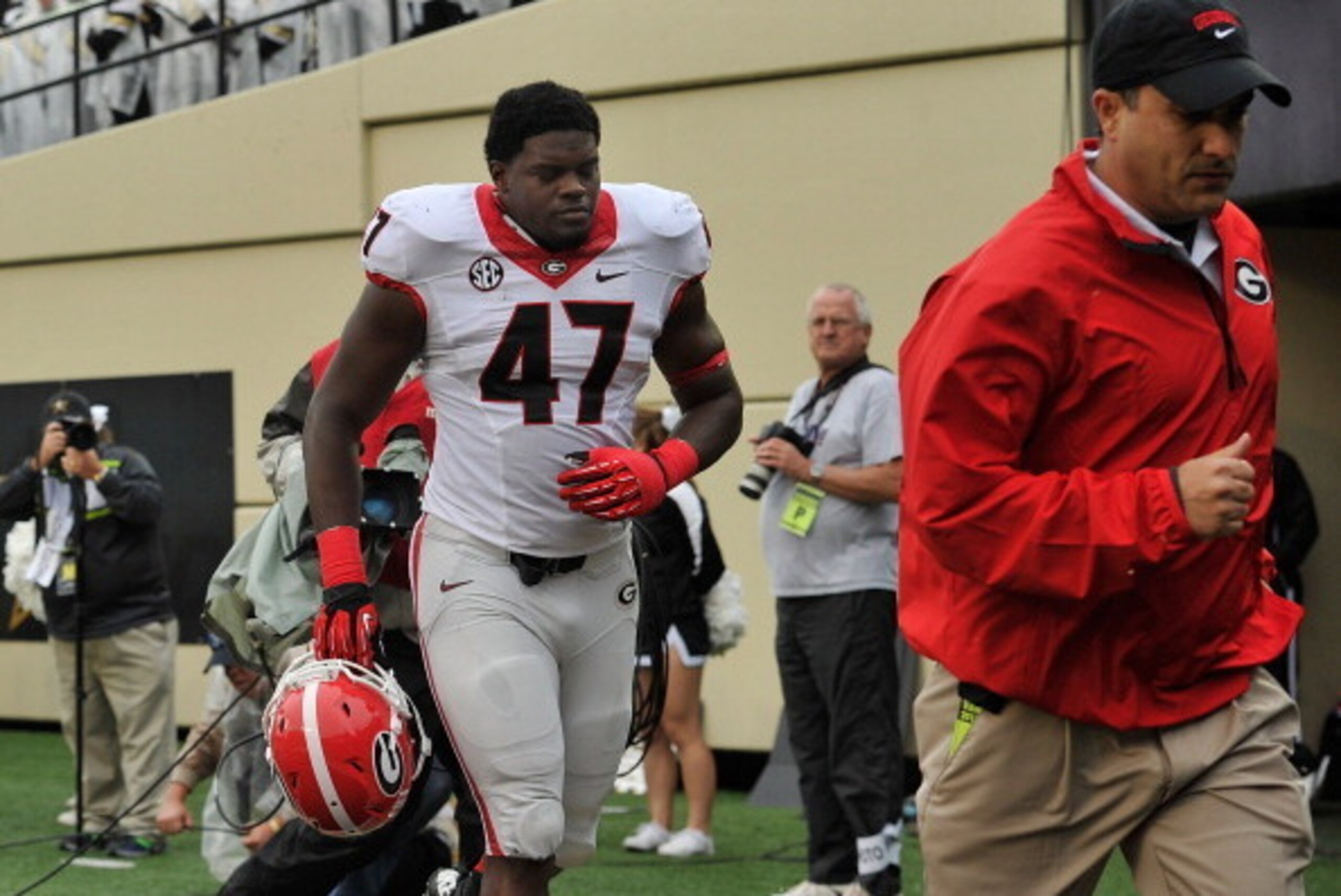NASHVILLE, TN - OCTOBER 19:  Ray Drew #47 of the Georgia Bulldogs is escorted off the field after being ejected from a game against the Vanderbilt Commodores at Vanderbilt Stadium on October 19, 2013 in Nashville, Tennessee.  (Photo by Frederick Breedon/G