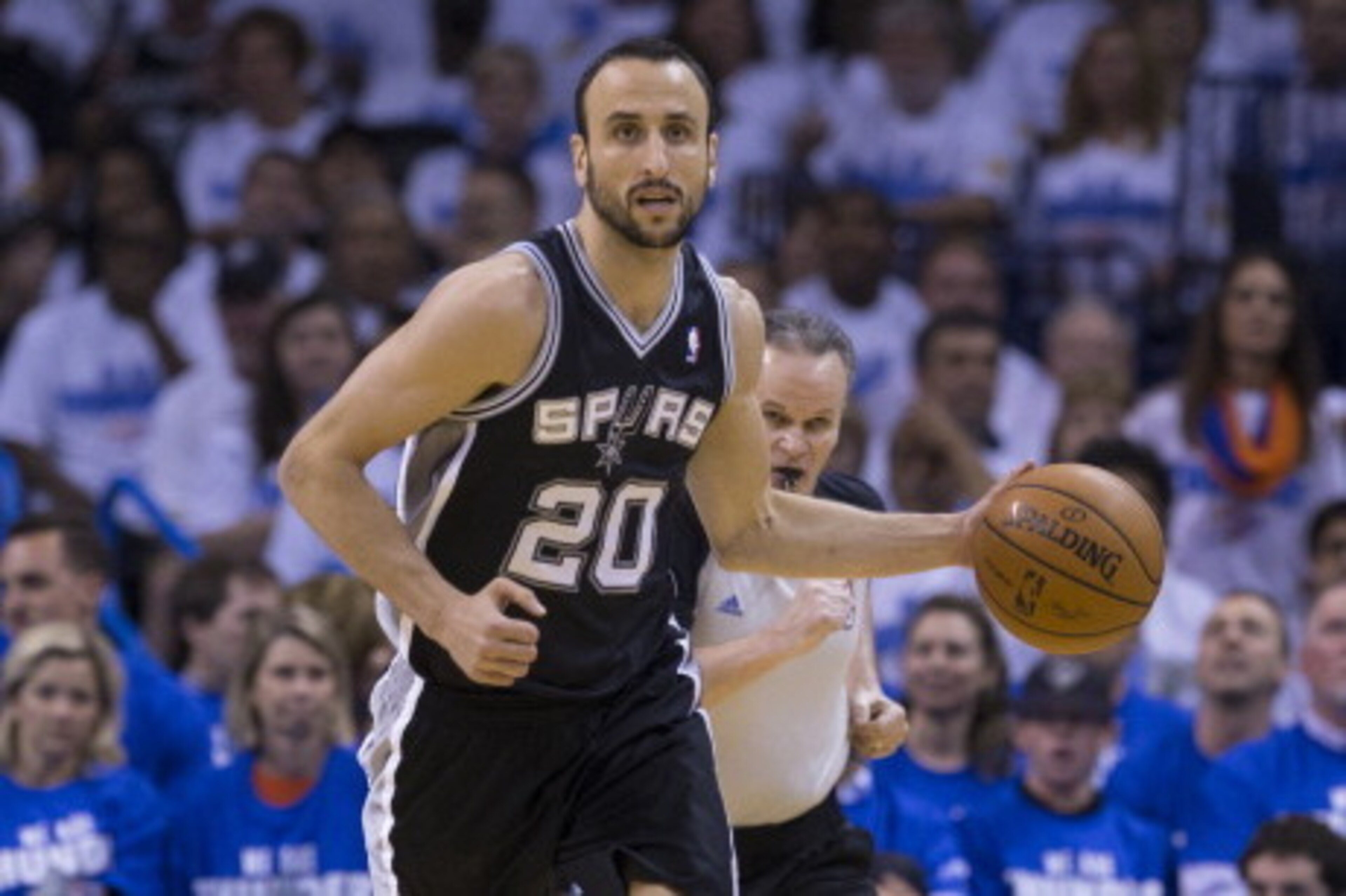 OKLAHOMA CITY, OK - May 27: Manu Ginobili #20 of the San Antonio Spurs dribbles up the court against the Oklahoma City Thunder in Game 4 of the Western Conference Finals during the 2014 NBA Playoffs at the Chesapeake Arena on May 27, 2014 in Oklahoma City