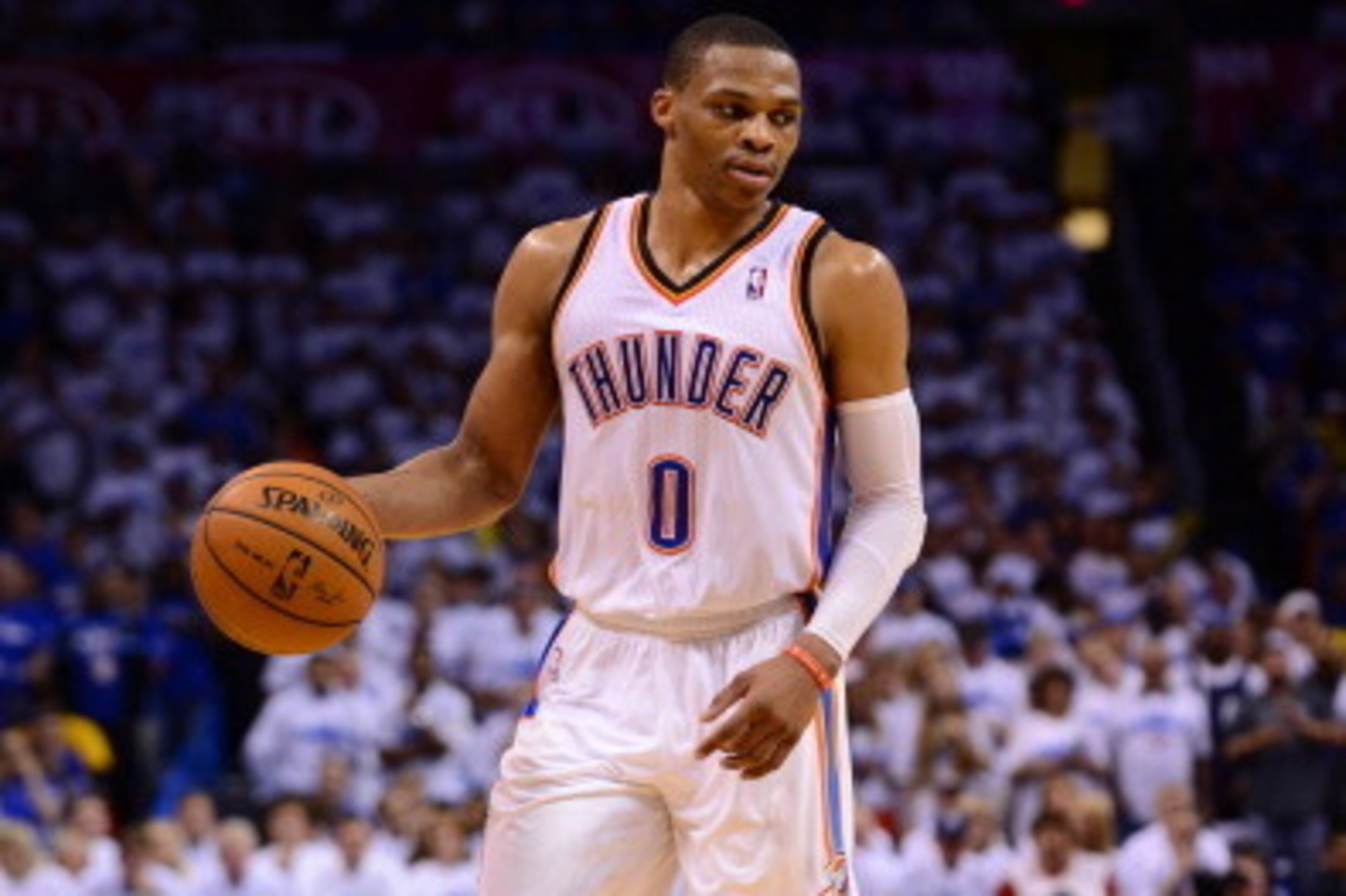 OKLAHOMA CITY, OK - MAY 27: Russell Westbrook #0 of the Oklahoma City Thunder dribbles the ball against the San Antonio Spurs in Game Four of the Western Conference Finals during the 2014 NBA Playoffs on May 27, 2014 at the Chesapeake Energy Arena in Okla