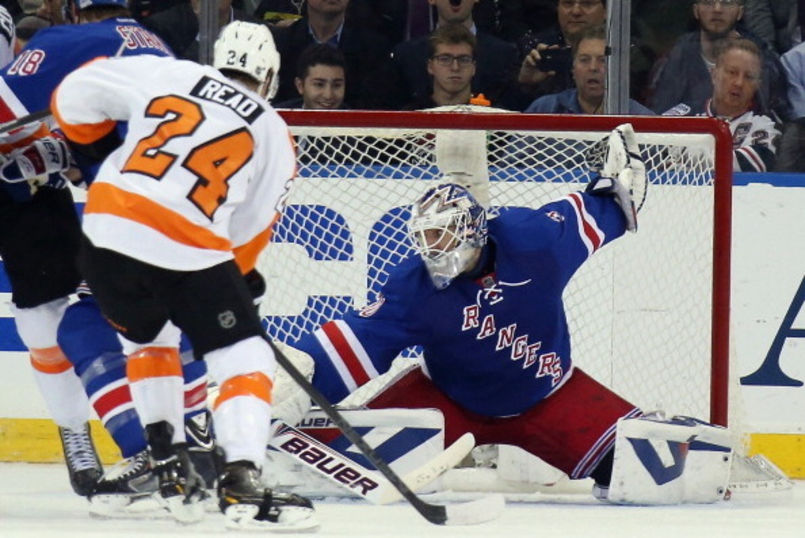 NEW YORK, NY - APRIL 30: Henrik Lundqvist #30 of the New York Rangers makes the save against the Philadelphia Flyers in Game Seven of the First Round of the 2014 NHL Stanley Cup Playoffs at Madison Square Garden on April 30, 2014 in New York City. The Ran