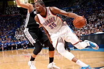 OKLAHOMA CITY, OK  MAY 27: Kevin Durant #35 of the Oklahoma City Thunder drives against the San Antonio Spurs in Game Four of the Western Conference Finals during the 2014 NBA Playoffs on May 27, 2014 at the Chesapeake Energy Arena in Oklahoma City, Oklah