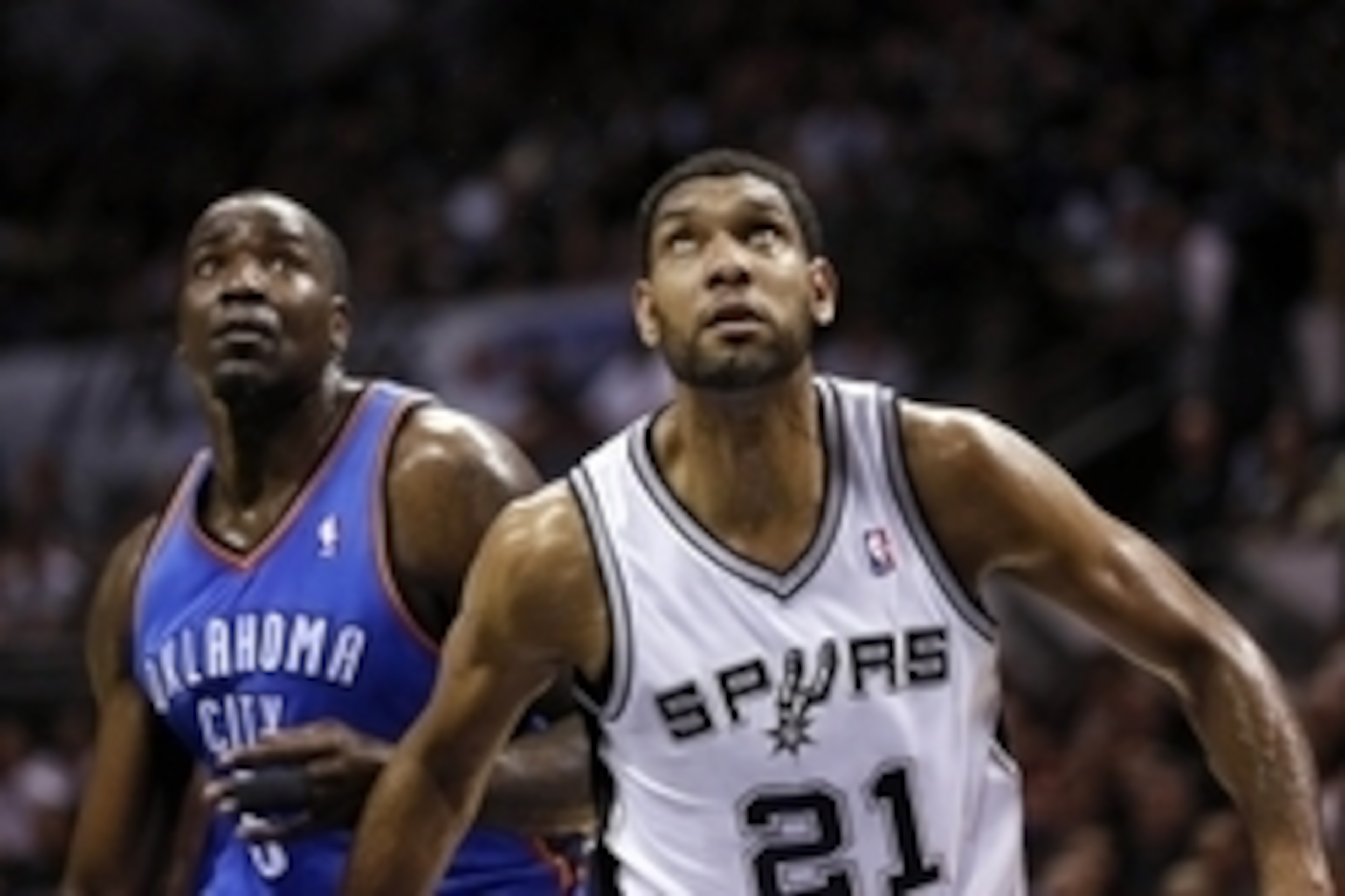 May 21, 2014; San Antonio, TX, USA; Oklahoma City Thunder center Kendrick Perkins (left) and San Antonio Spurs forward Tim Duncan (21) battle for rebounding position in game two of the Western Conference Finals of the 2014 NBA Playoffs at AT&T Center. Man
