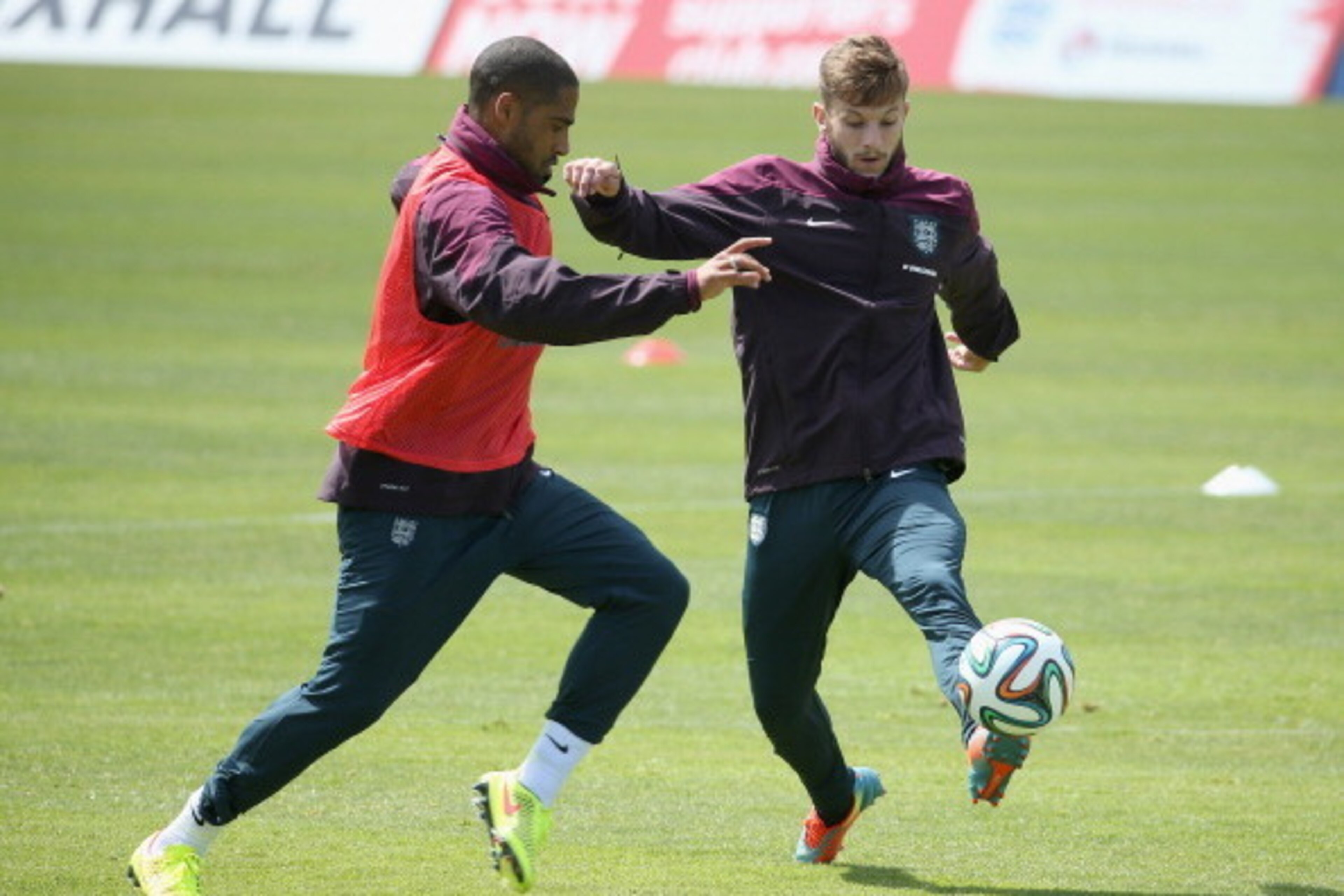 VALE DO LOBO, ALGARVE, PORTUGAL - MAY 21:  Glen Johnson and Adam Lallana in action during a training session at the England pre-World Cup Training Camp at the Vale Do Lobo Resort on May 21, 2014 in Vale Do Lobo, Algarve, Portugal.  (Photo by Richard Heath