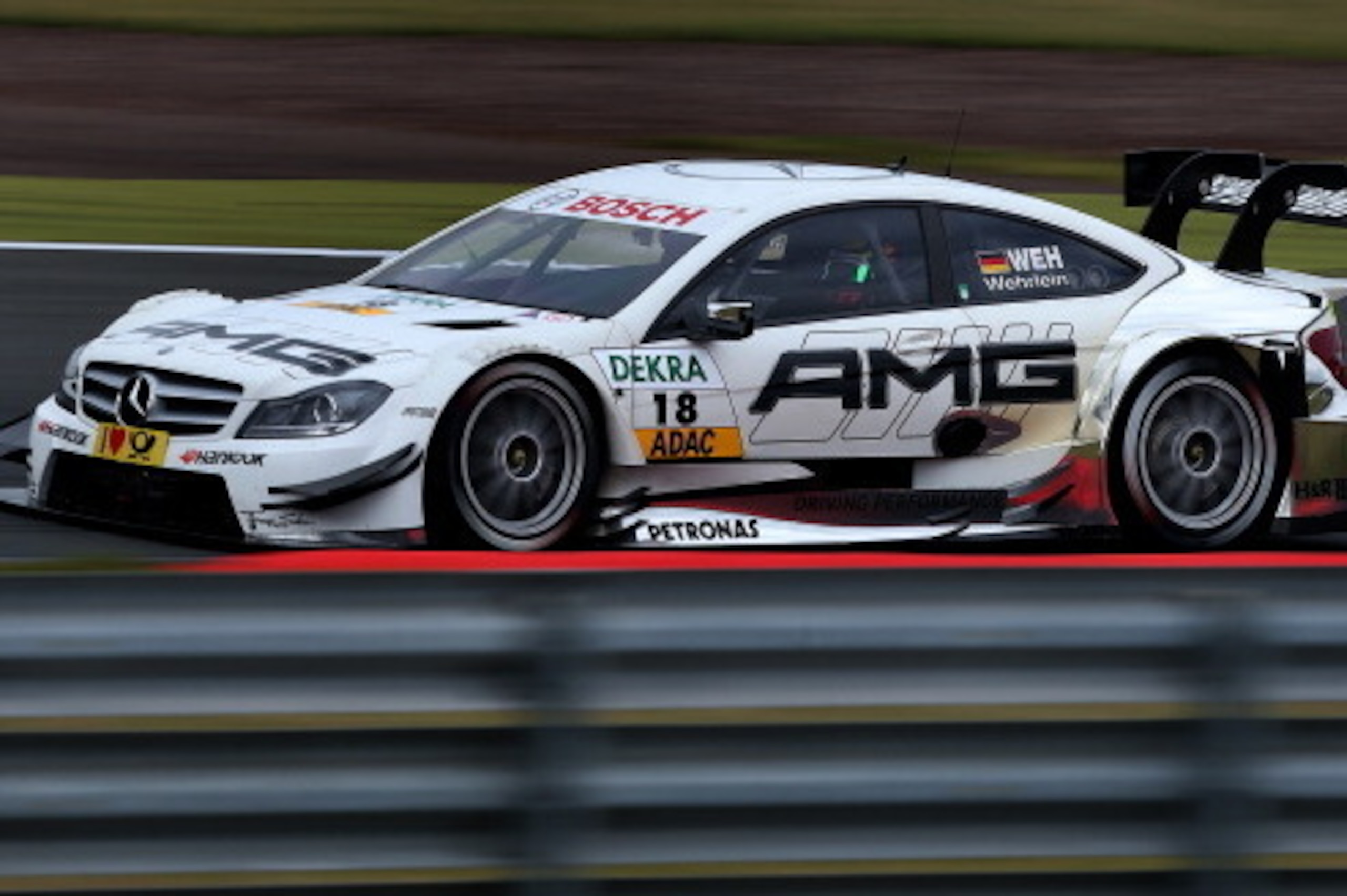 OSCHERSLEBEN, GERMANY - SEPTEMBER 15:  Pascal Wehrlein of Germany and Mercedes AMG steers his car during the eighth round of the DTM 2013 German Touring Car Championship at Etropolis Motorsport Arena Oschersleben on September 15, 2013 in Oschersleben, Ger