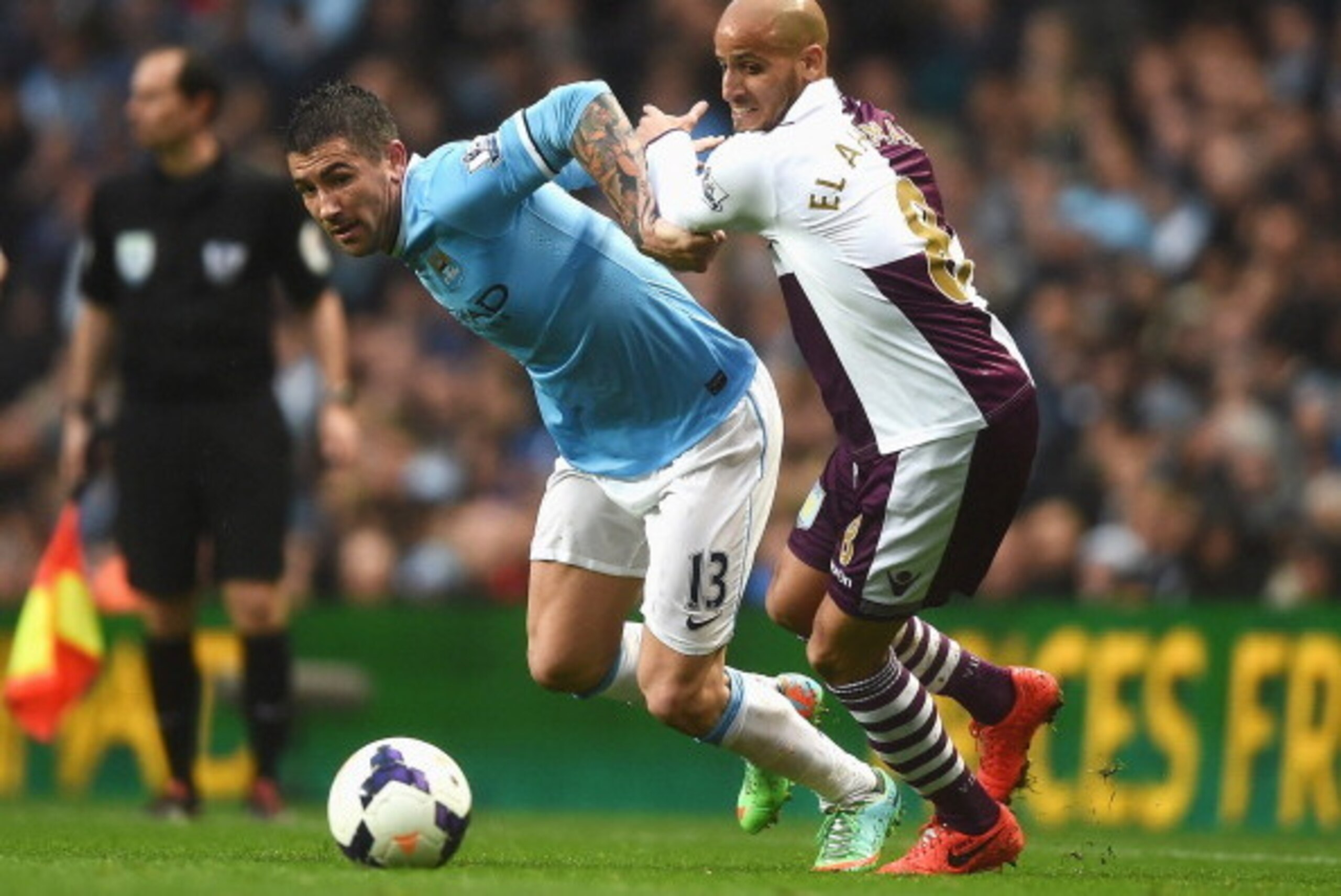 MANCHESTER, ENGLAND - MAY 07: Aleksandar Kolarov of Manchester City is challenged by Karim El Ahmadi of Aston Villa during the Barclays Premier League match between Manchester City and Aston Villa at Etihad Stadium on May 7, 2014 in Manchester, England. MANCHESTER, ENGLAND - MAY 07: Aleksandar Kolarov of Manchester City is challenged by Karim El Ahmadi of Aston Villa during the Barclays Premier League match between Manchester City and Aston Villa at Etihad Stadium on May 7, 2014 in Manchester, England.
