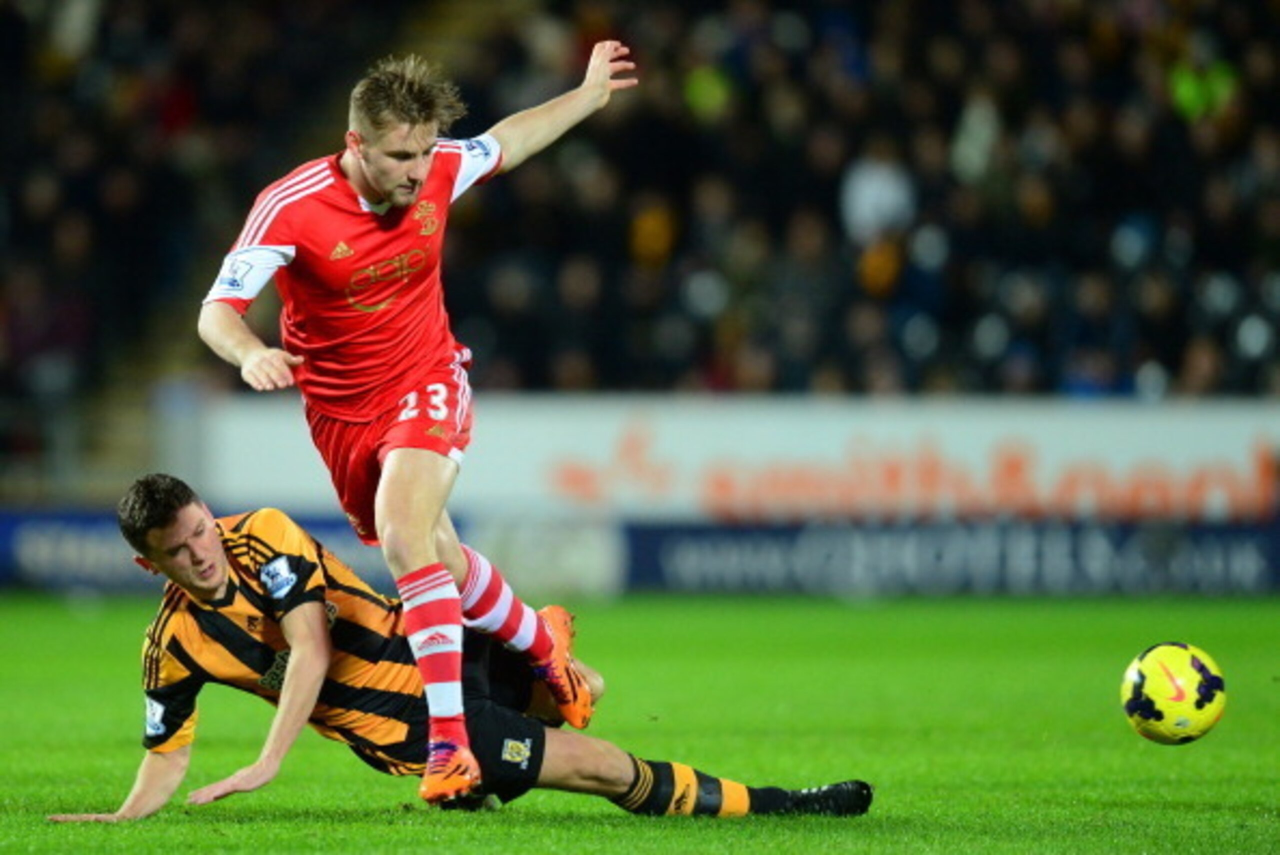 HULL, ENGLAND - FEBRUARY 11: Alex Bruce of Hull City slides in for a tackle on Luke Shaw of Southampton during the Barclays Premier League match between Hull City and Southampton at the KC Stadium on February 11, 2014 in Hull, England. (Photo by Jamie M HULL, ENGLAND - FEBRUARY 11: Alex Bruce of Hull City slides in for a tackle on Luke Shaw of Southampton during the Barclays Premier League match between Hull City and Southampton at the KC Stadium on February 11, 2014 in Hull, England. (Photo by Jamie M