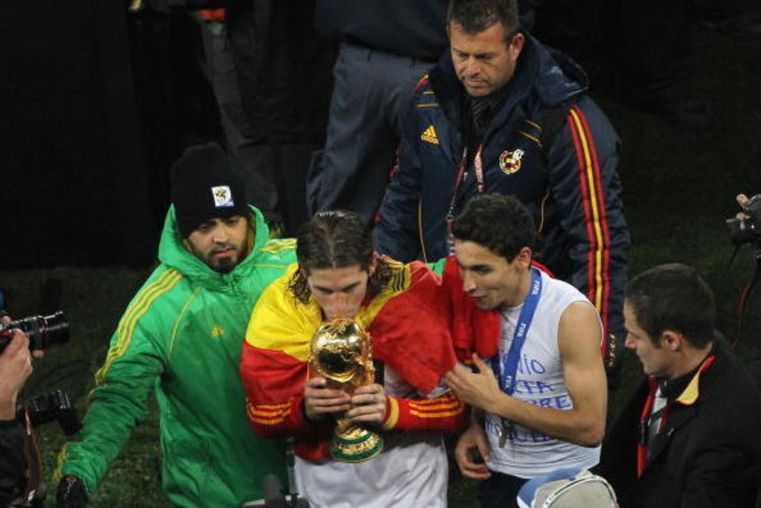 JOHANNESBURG, SOUTH AFRICA - JULY 11:  Sergio Ramos of Spain kisses the World Cup trophy following the 2010 FIFA World Cup South Africa Final match between Netherlands and Spain at Soccer City Stadium on July 11, 2010 in Johannesburg, South Africa.  (Phot
