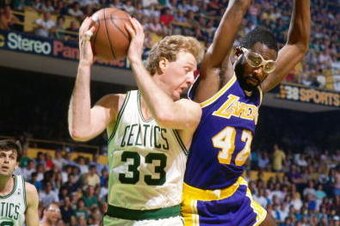 BOSTON - 1987:  Larry Bird #33 of the Boston Celtics rebounds against James Worthy #33 of the Los Angeles Lakers during the 1987 NBA Finals at the Boston Garden in Boston, Massachusetts. The Los Angeles Lakers defeated the Boston Celtics 4-2 to win the NB