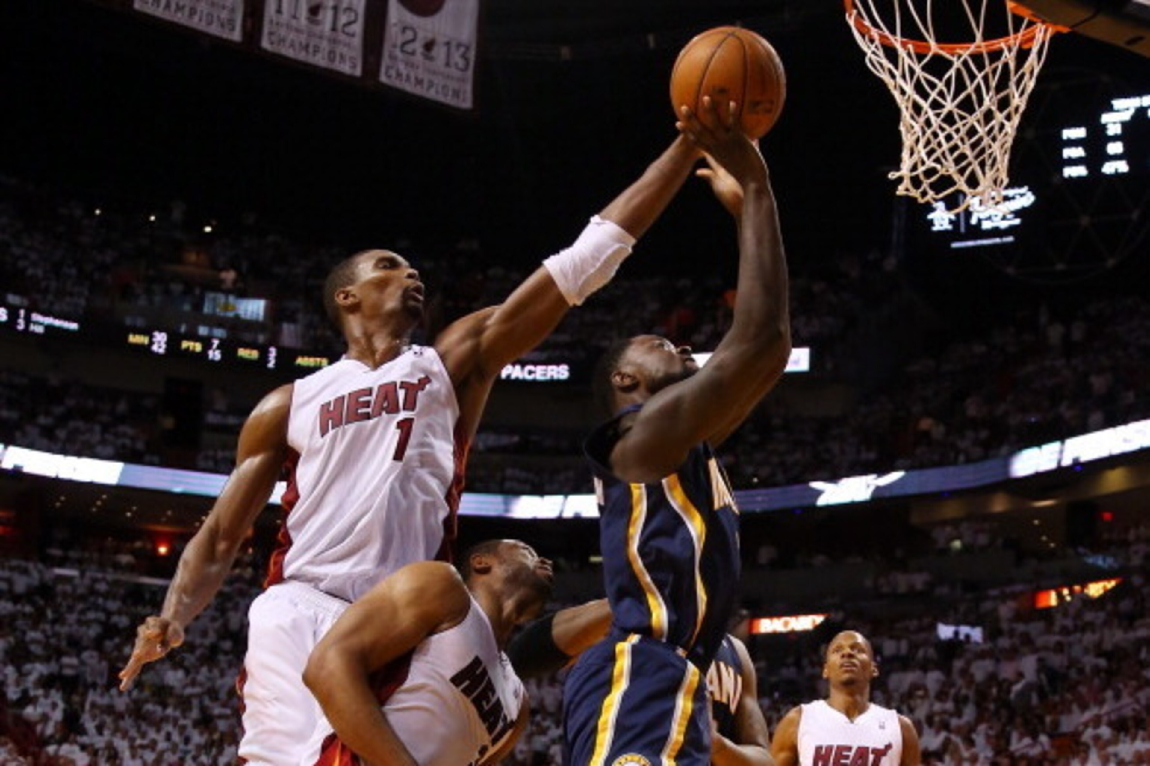 MIAMI, FL - MAY 26: Chris Bosh #1 of the Miami Heat defends against Roy Hibbert #55 of the Indiana Pacers  during Game Four of the Eastern Conference Finals of the 2014 NBA Playoffs at American Airlines Arena on May 26, 2014 in Miami, Florida. NOTE TO USE