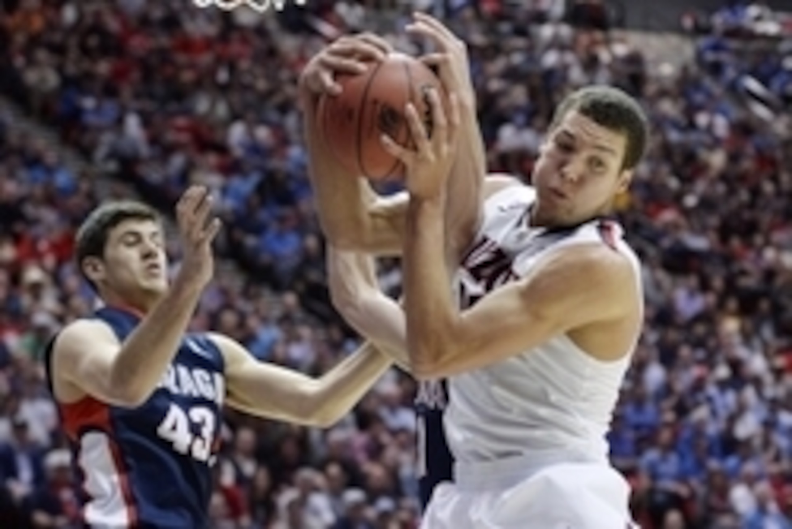 Mar 23, 2014; San Diego, CA, USA; Arizona Wildcats forward Aaron Gordon (right) pulls down a rebound against Gonzaga Bulldogs guard/forward Drew Barham (43) and guard David Stockton in the first half of a men's college basketball game during the third rou