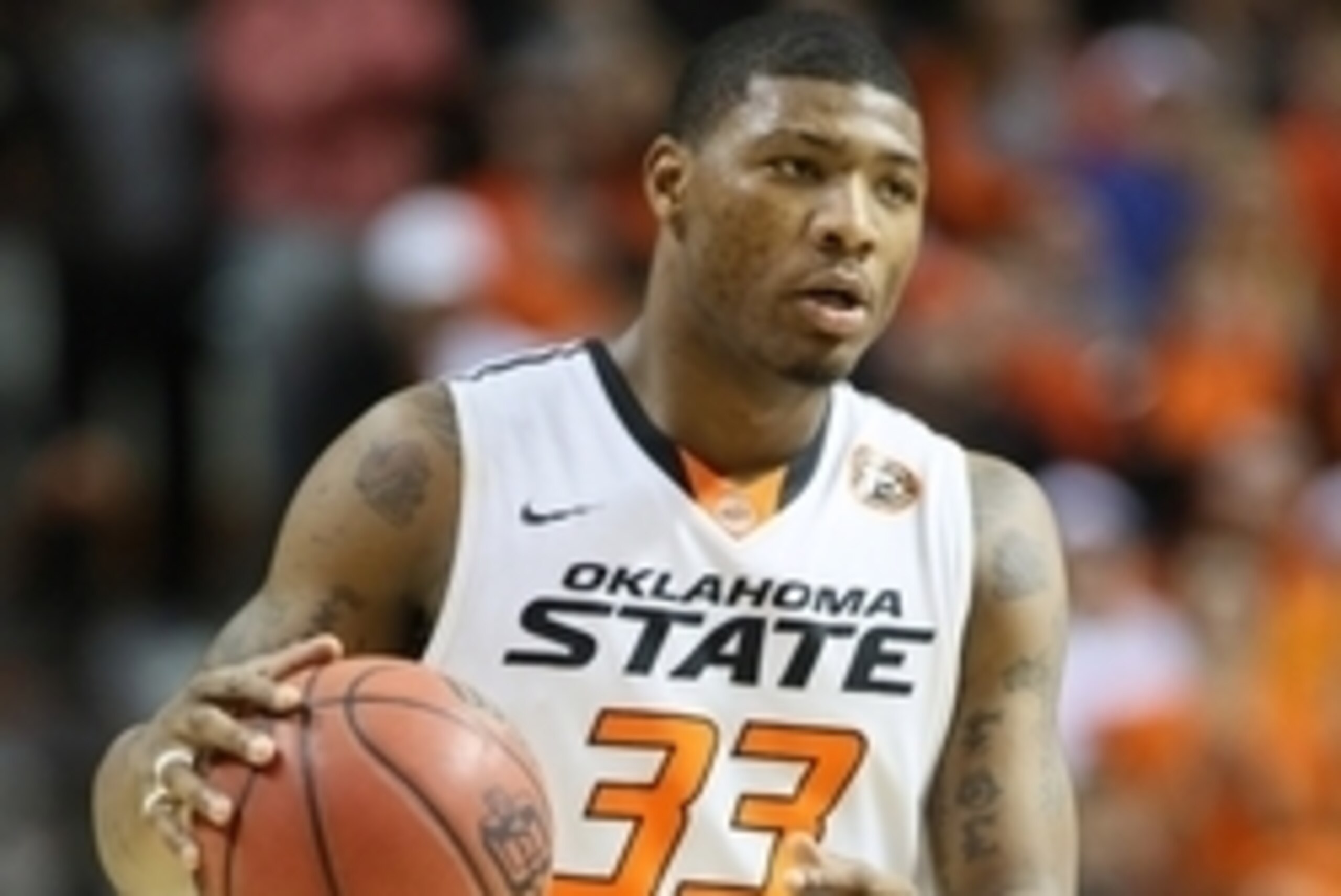 Feb 3, 2014; Stillwater, OK, USA; Oklahoma State Cowboys guard Marcus Smart (33) during the game against the Iowa State Cyclones at Gallagher-Iba Arena. Iowa State defeated Oklahoma State 98-97 in triple overtime. Mandatory Credit: Nelson Chenault-USA TOD