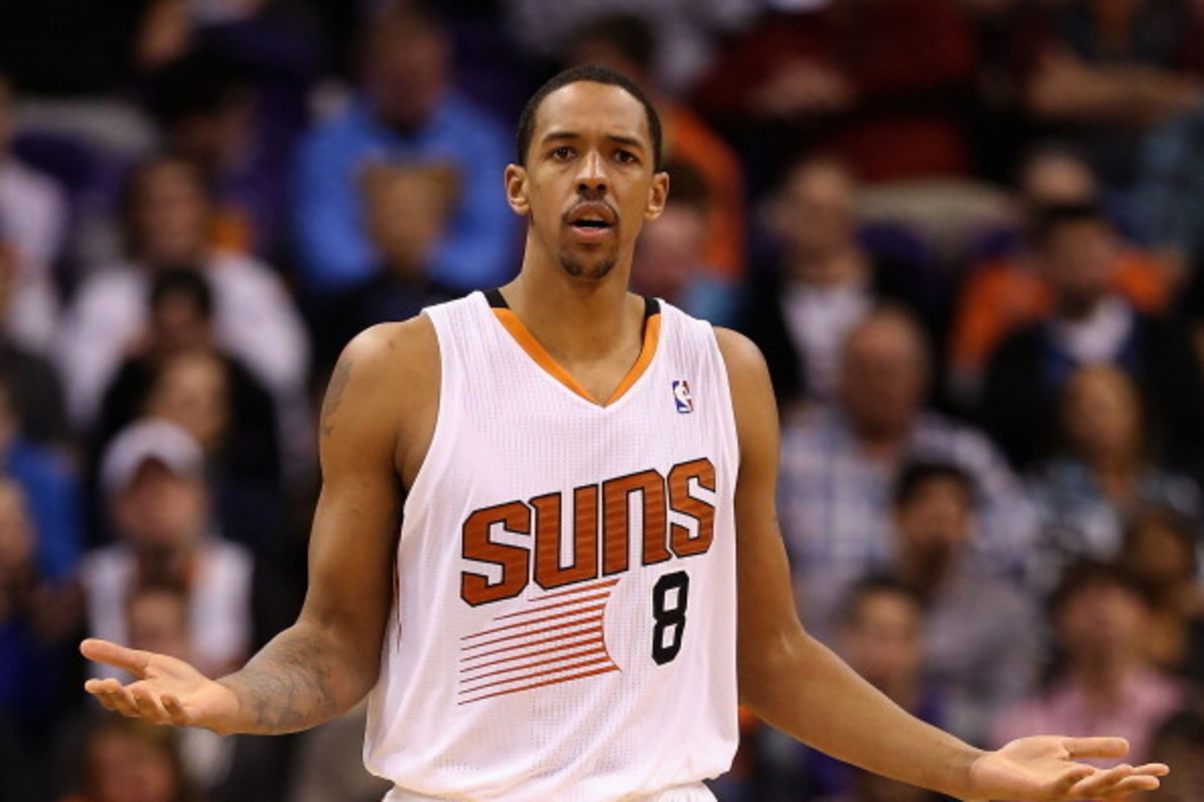 PHOENIX, AZ - DECEMBER 21: Channing Frye #8 of the Phoenix Suns reacts during the NBA game against the Dallas Mavericks at US Airways Center on December 21, 2013 in Phoenix, Arizona. The Suns defeated the Mavericks 123-108. NOTE TO USER: User expressly PHOENIX, AZ - DECEMBER 21: Channing Frye #8 of the Phoenix Suns reacts during the NBA game against the Dallas Mavericks at US Airways Center on December 21, 2013 in Phoenix, Arizona. The Suns defeated the Mavericks 123-108. NOTE TO USER: User expressly