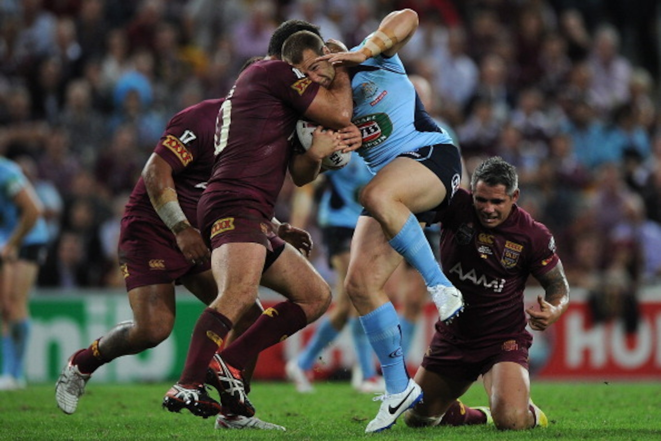 BRISBANE, AUSTRALIA - MAY 28: Trent Merrin of the Blues is tackled during game one of the State of Origin series between the Queensland Maroons and the New South Wales Blues at Suncorp Stadium on May 28, 2014 in Brisbane, Australia.  (Photo by Matt Robert