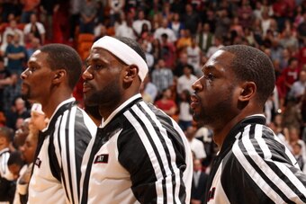 MIAMI, FL - JANUARY 2: Dwyane Wade #3, LeBron James #6, and Chris Bosh #1 of the Miami Heat stand during the national anthem before the game against the Golden State Warriors at the American Airlines Arena in Miami, Florida on Jan. 23, 2014. NOTE TO USER: