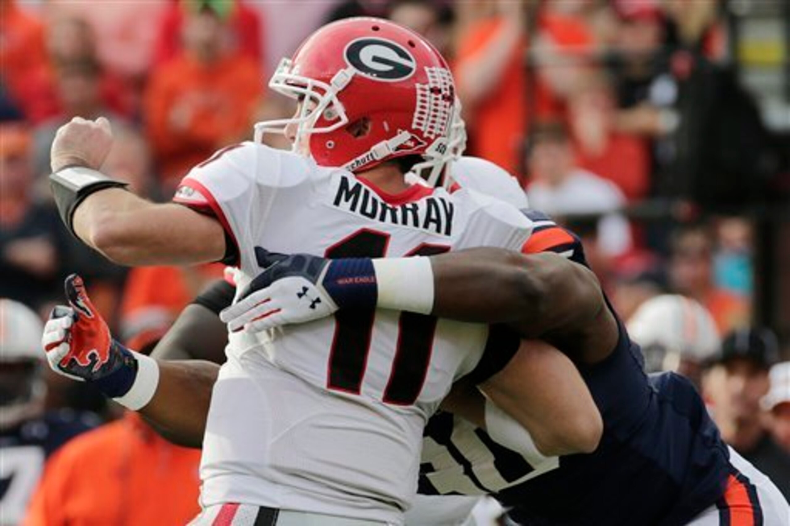 Georgia QB Aaron Murray is sacked by Auburn DE Dee Ford