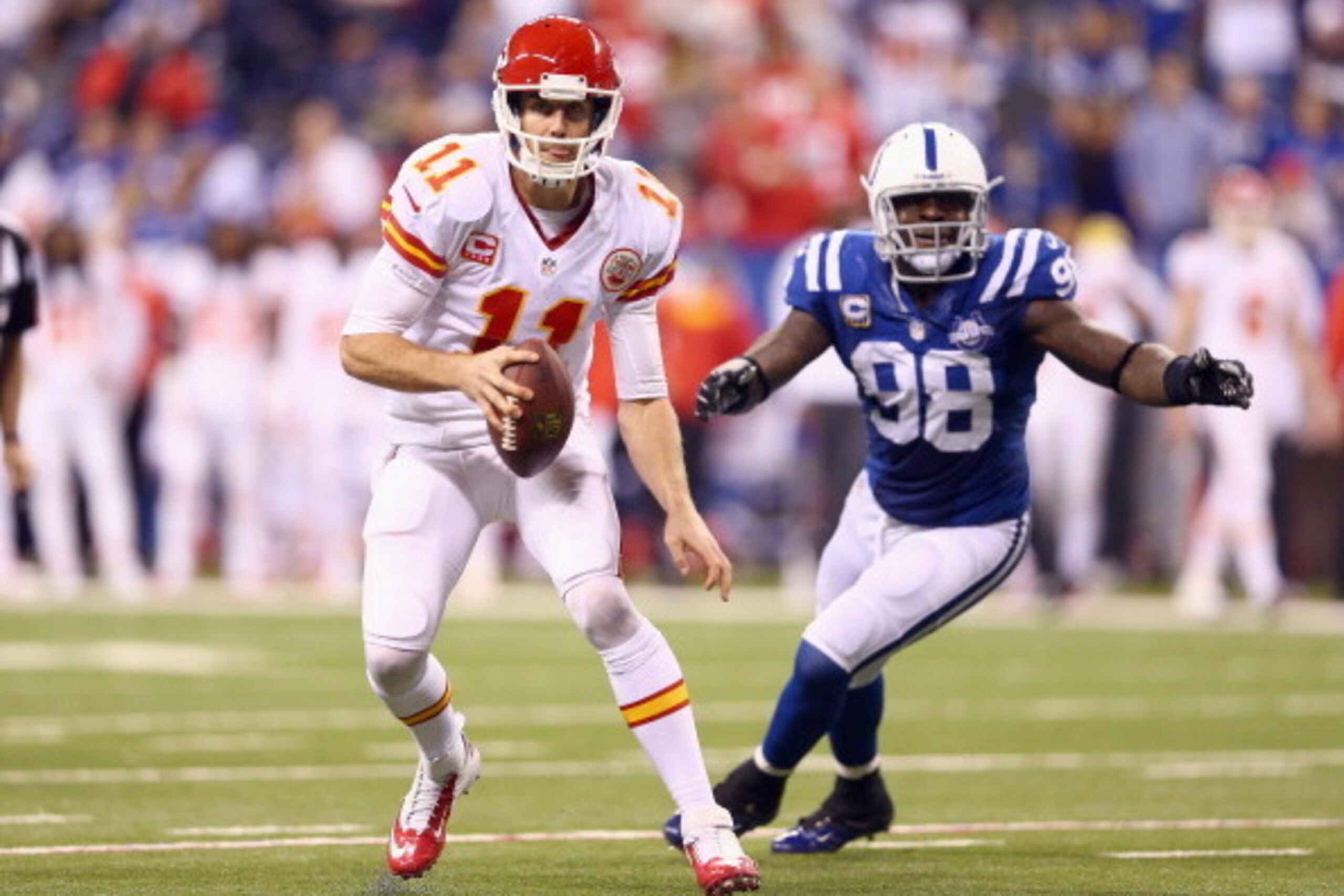 INDIANAPOLIS, IN - JANUARY 04:  Alex Smith #11 of the Kansas City Chiefs runs with the ball during the NFL Wild Card Playoff game against the Indianapolis Colts  at Lucas Oil Stadium on January 4, 2014 in Indianapolis, Indiana.  (Photo by Andy Lyons/Getty