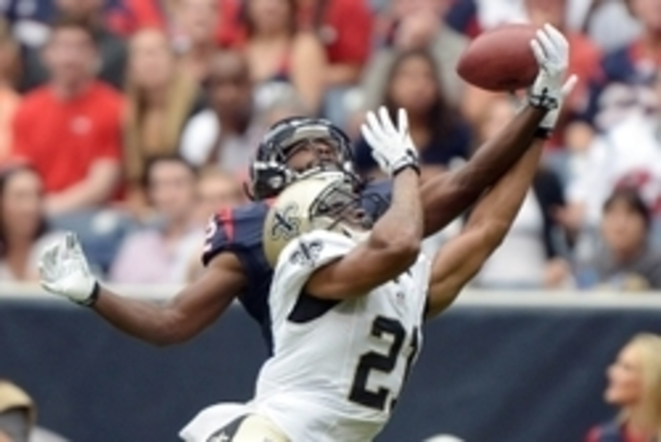 Aug 25, 2013; Houston, TX, USA; Houston Texans receiver Keshawn Martin (82) is defended by New Orleans Saints cornerback Patrick Robinson (21) at Reliant Stadium. Mandatory Credit: Kirby Lee-USA TODAY Sports