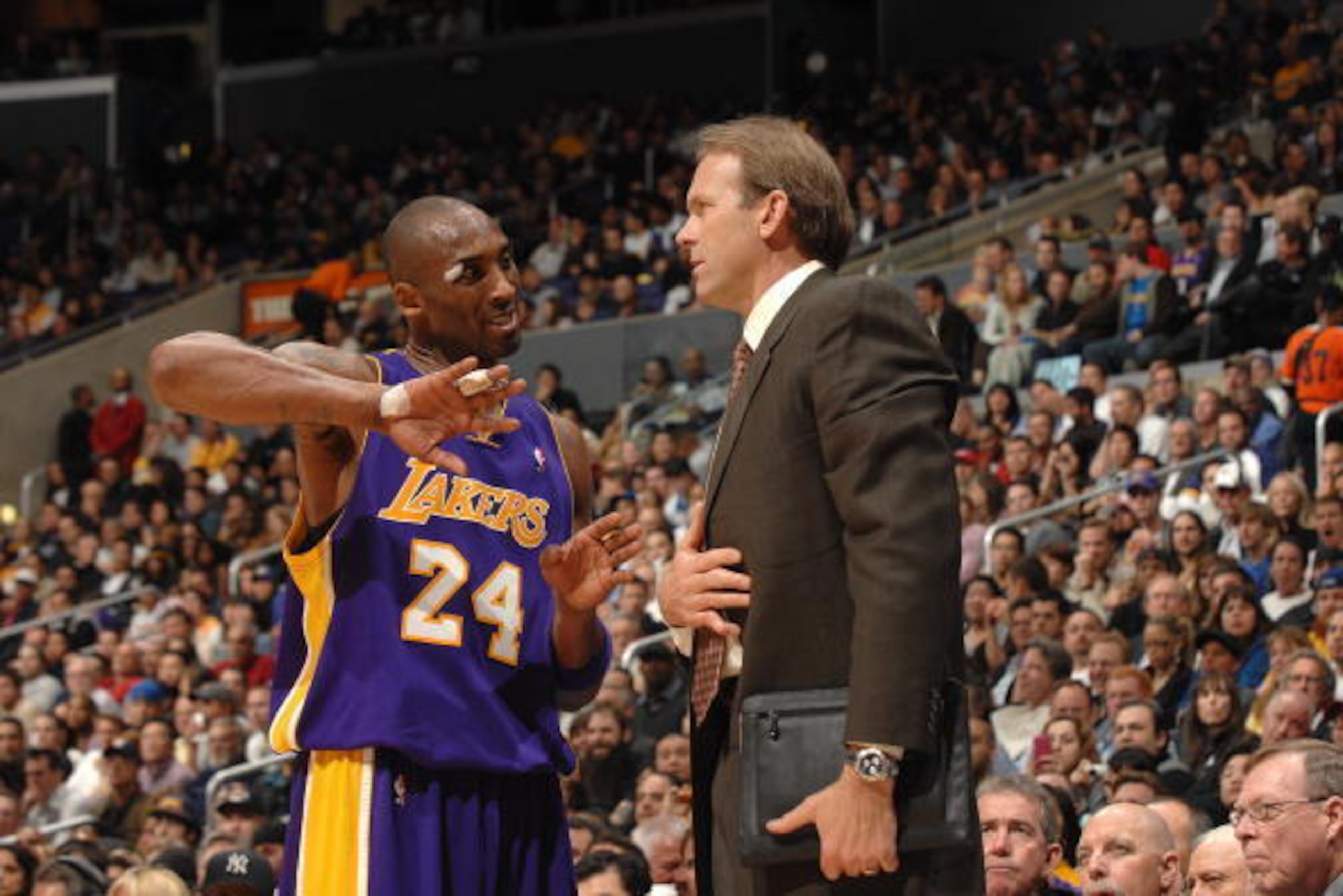 LOS ANGELES - JANUARY 21:  Kobe Bryant #24 and assistant coach Kurt Rambis of the Los Angeles Lakers talk during the game against the Los Angeles Clippers at Staples Center on January 21, 2009 in Los Angeles, California. The Lakers won 108-97.  NOTE TO US