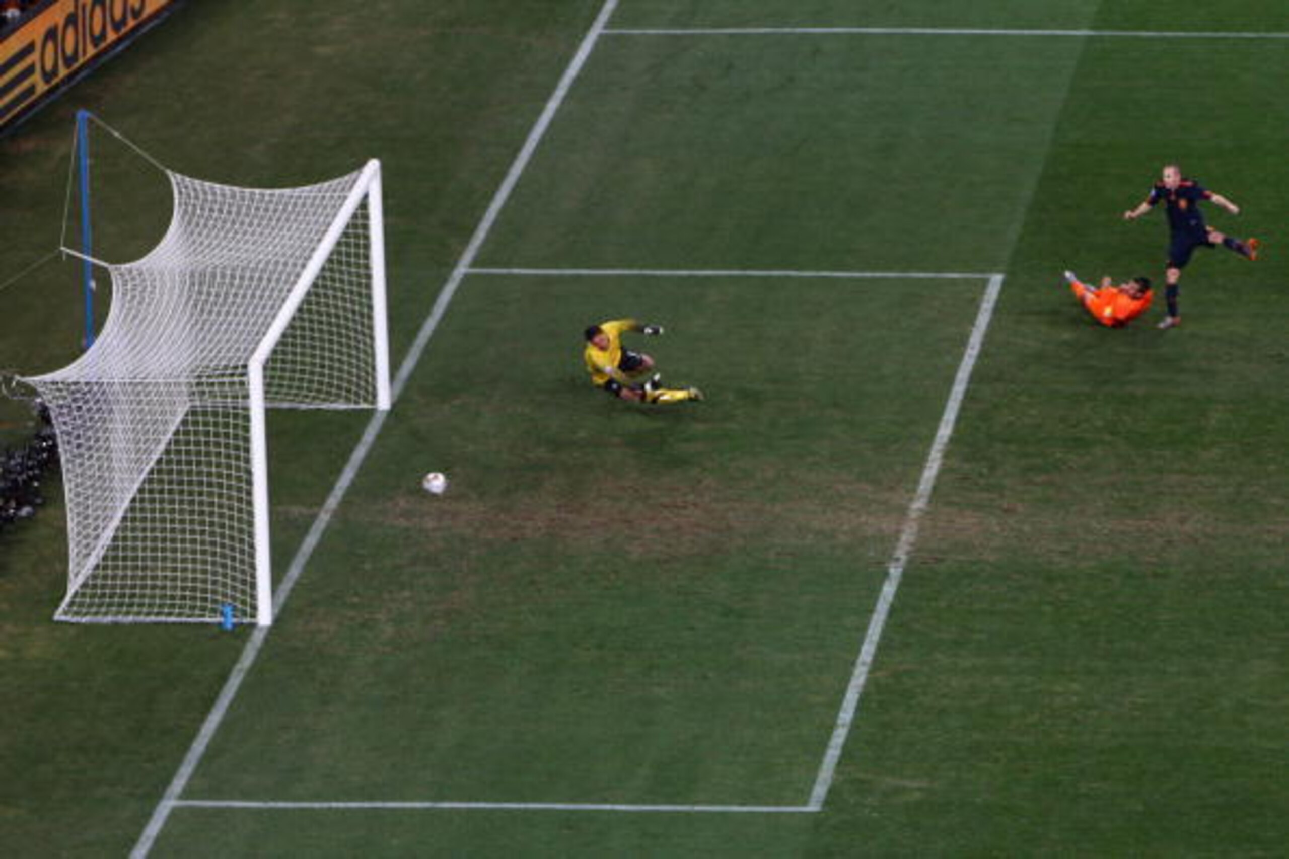 JOHANNESBURG, SOUTH AFRICA - JULY 11:  Andres Iniesta of Spain scores the winning goal during the 2010 FIFA World Cup South Africa Final match between Netherlands and Spain at Soccer City Stadium on July 11, 2010 in Johannesburg, South Africa.  (Photo by 