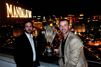 LAS VEGAS, NV - NOVEMBER 30:  Five-time NASCAR Sprint Cup Series Champion Jimmie Johnson (L) and crew chief Chad Knaus (R) pose with the 2010 trophy at the House of Blues Foundation Room inside Mandalay Bay Resort & Casino during Day 1 of the NASCAR Sprin