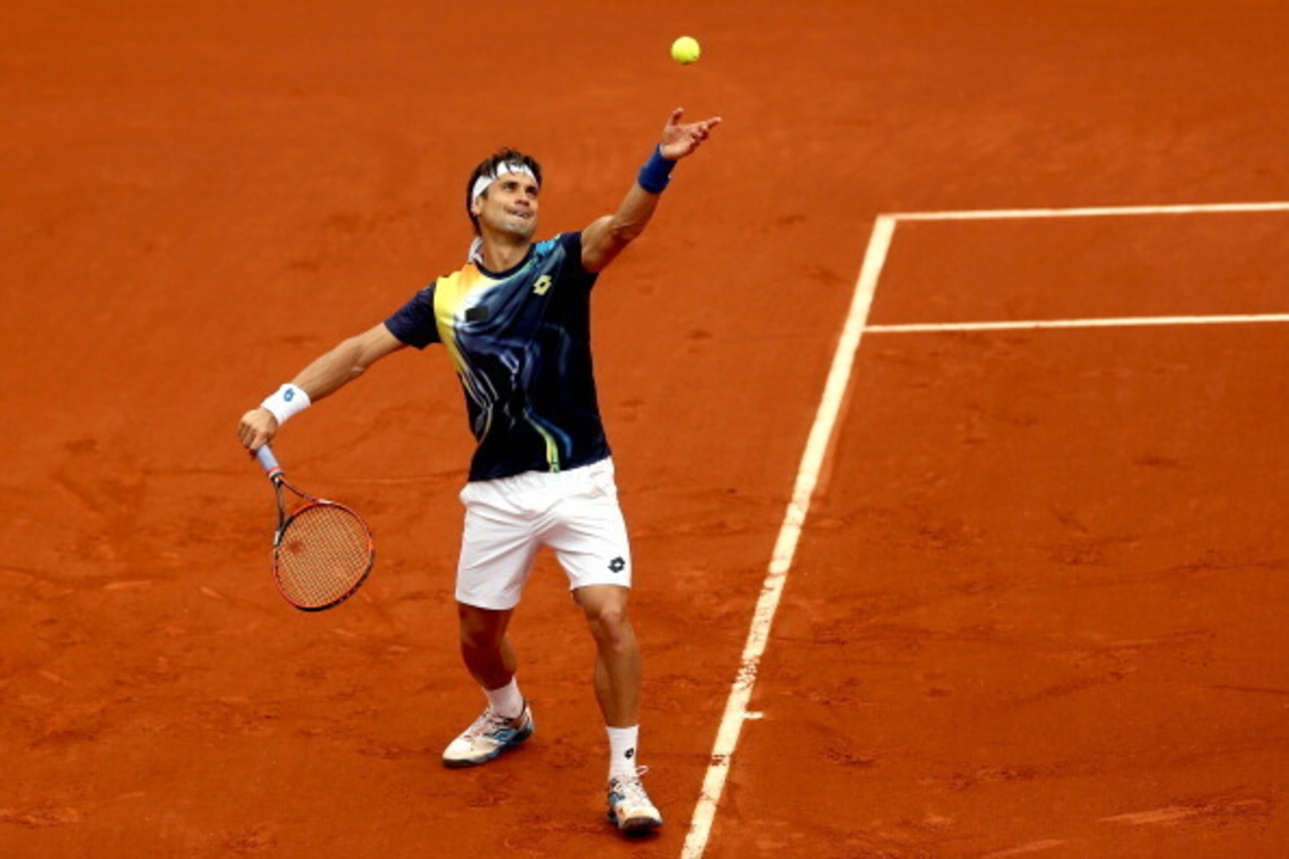 PARIS, FRANCE - MAY 27:  David Ferrer of Spain serves during his men's singles match against Igor Sijsling of Netherlands on day three of the French Open at Roland Garros on May 27, 2014 in Paris, France.  (Photo by Matthew Stockman/Getty Images)