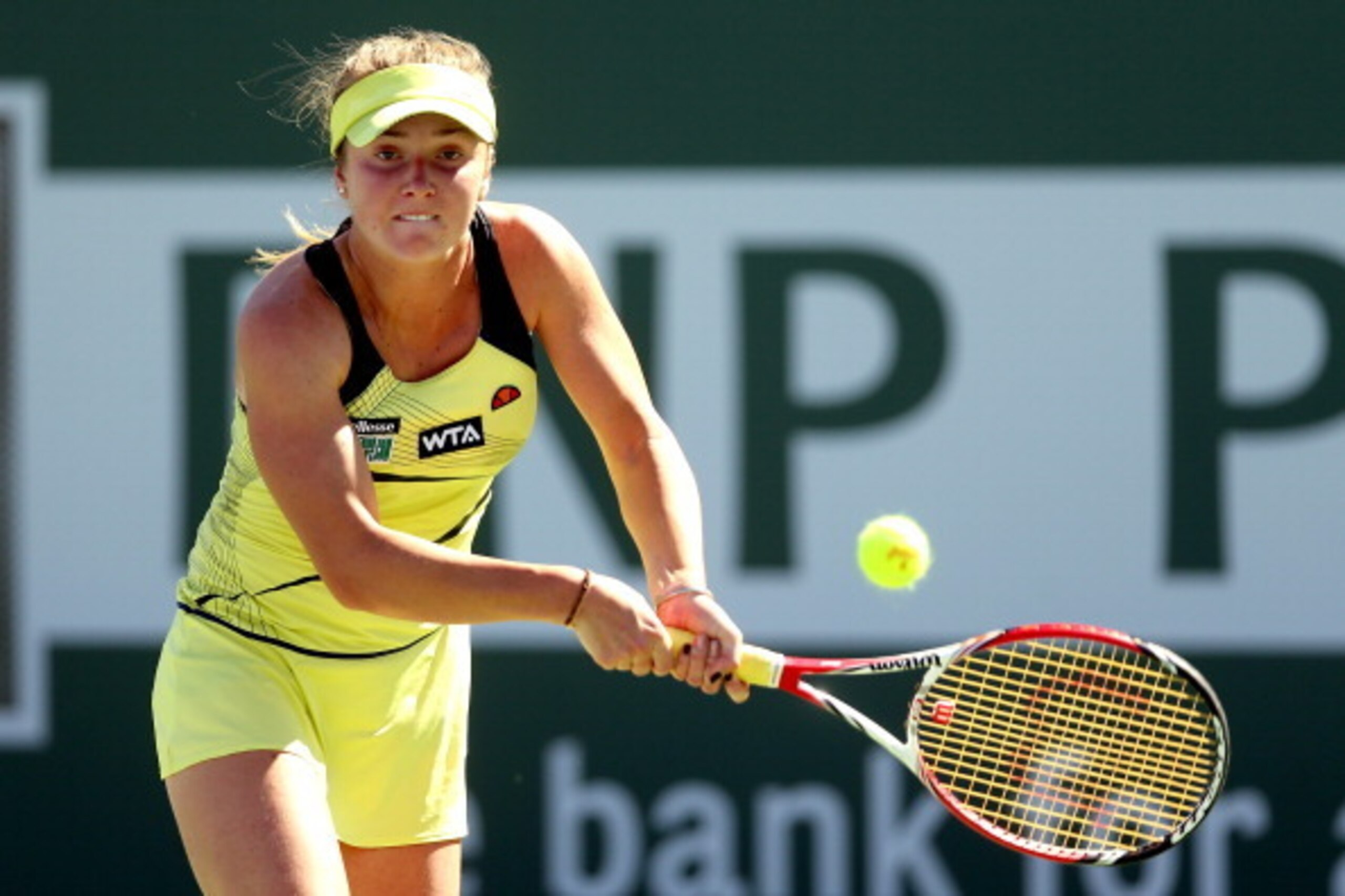 INDIAN WELLS, CA - MARCH 08:  Elina Svitolina of Ukraine returns a shot to Ana Ivanovic of Serbia during the BNP Parabas Open at the Indian Wells Tennis Garden on March 8, 2014 in Indian Wells, California.  (Photo by Matthew Stockman/Getty Images)