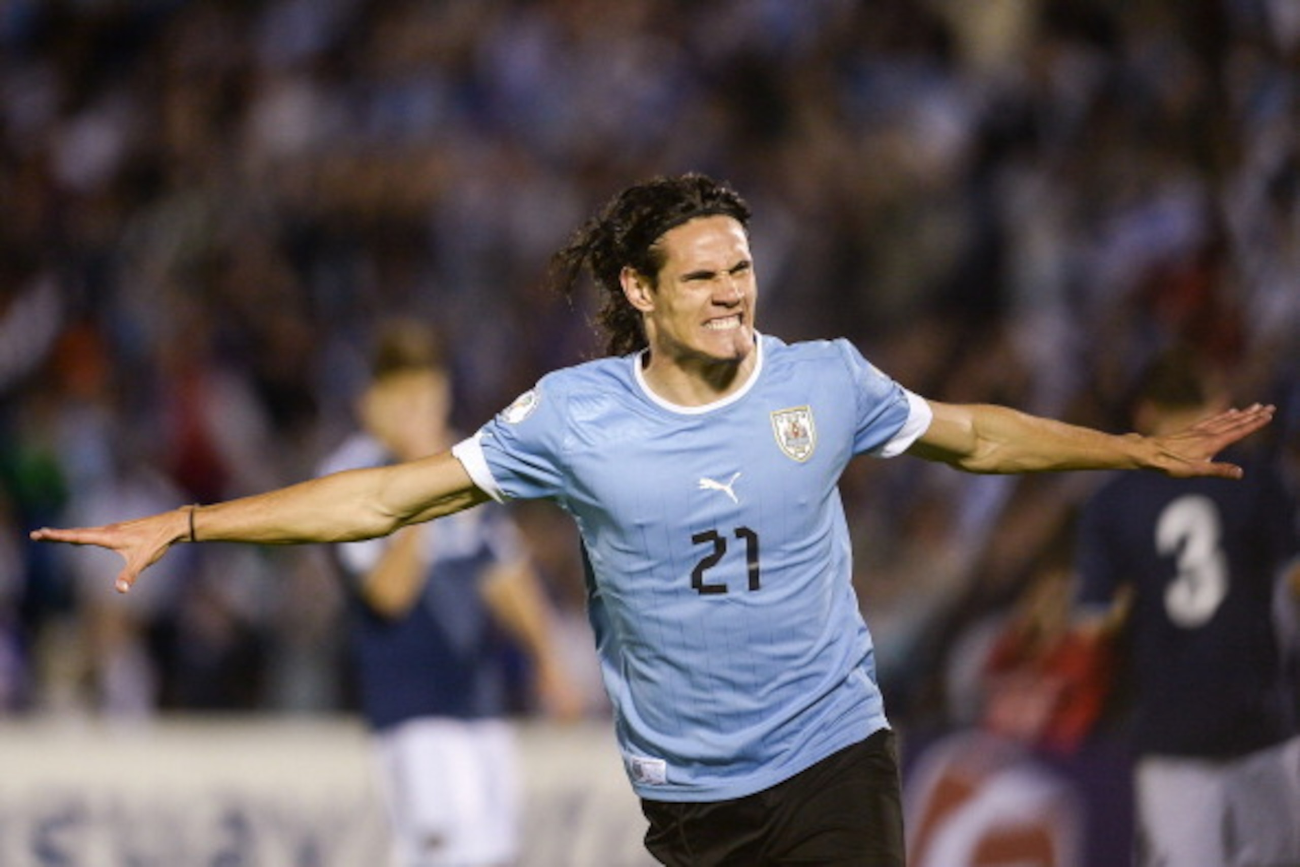 MONTEVIDEO, URUGUAY - OCTOBER 15: Edinson Cavani (#21) of Uruguay celebrates a goal during a match between Uruguay and Argentina as part of the 18th round of the South American Qualifiers for the FIFA's World Cup Brazil 2014 at Centenario Stadium Stadium MONTEVIDEO, URUGUAY - OCTOBER 15: Edinson Cavani (#21) of Uruguay celebrates a goal during a match between Uruguay and Argentina as part of the 18th round of the South American Qualifiers for the FIFA's World Cup Brazil 2014 at Centenario Stadium Stadium