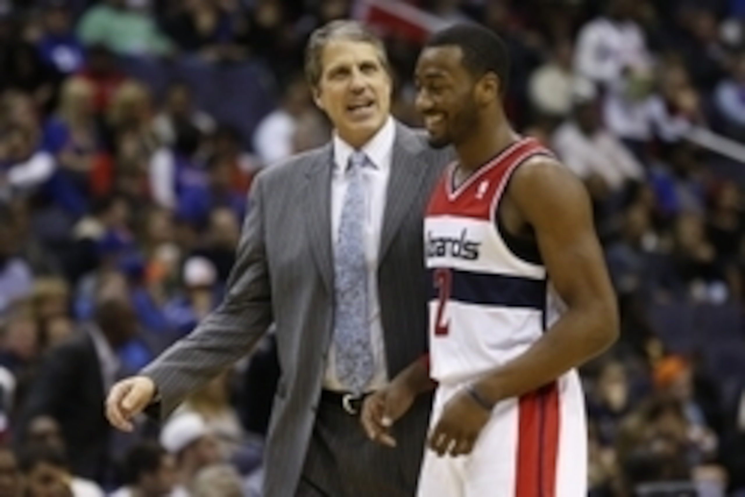 Nov 23, 2013; Washington, DC, USA;  Washington Wizards point guard John Wall (2) smiles while talking to Wizards head coach Randy Wittman against the New York Knicks in the fourth quarter at Verizon Center. The Wizards won 98-89. Mandatory Credit: Geoff B