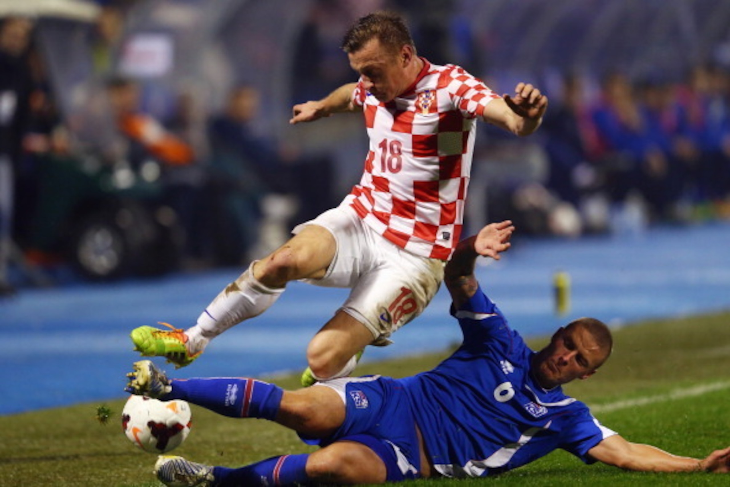 ZAGREB, CROATIA - NOVEMBER 19: Ivica Olic (top) of Croatia is challenged by Ragnar Sigurdsson of Iceland during the FIFA 2014 World Cup Qualifier play-off second leg match between Croatia and Iceland at Maksimir Stadium on November 19, 2013 in Zagreb, Cro ZAGREB, CROATIA - NOVEMBER 19: Ivica Olic (top) of Croatia is challenged by Ragnar Sigurdsson of Iceland during the FIFA 2014 World Cup Qualifier play-off second leg match between Croatia and Iceland at Maksimir Stadium on November 19, 2013 in Zagreb, Cro