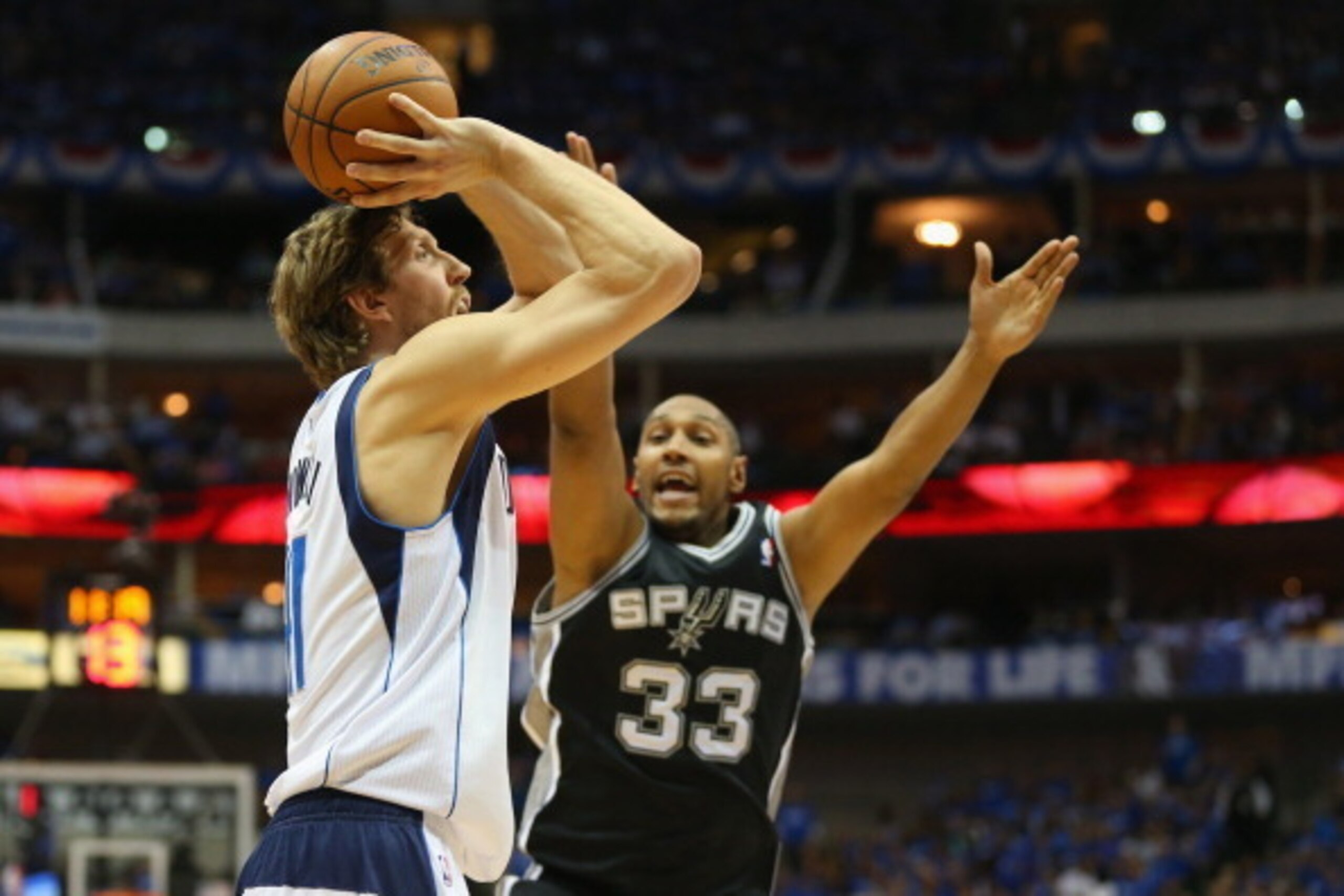 DALLAS, TX - MAY 02:  Dirk Nowitzki #41 of the Dallas Mavericks takes a shot against Boris Diaw #33 of the San Antonio Spurs in Game Six of the Western Conference Quarterfinals during the 2014 NBA Playoffs at American Airlines Center on May 2, 2014 in Dal