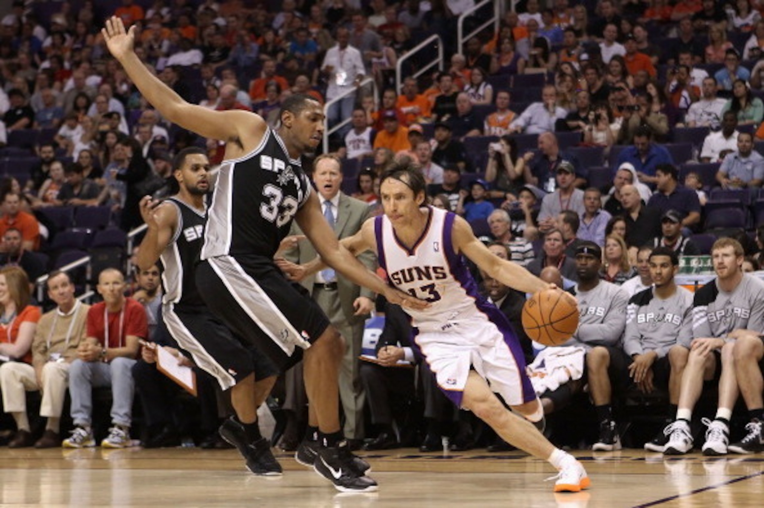 PHOENIX, AZ - APRIL 25:  Steve Nash #13 of the Phoenix Suns drives the ball past Boris Diaw #33 of the San Antonio Spurs during the NBA game at US Airways Center on April 25, 2012 in Phoenix, Arizona.  The Spurs defeated the Suns 110-106.  NOTE TO USER: U