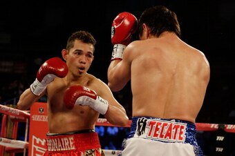 HOUSTON, TX - DECEMBER 15:  Nonito Donaire of the Philippines (L) boxes with Jorge Arce of Mexico during their WBO World Super Bantamweight bout at the Toyota Center on December 15, 2012 in Houston, Texas.  (Photo by Scott Halleran/Getty Images)