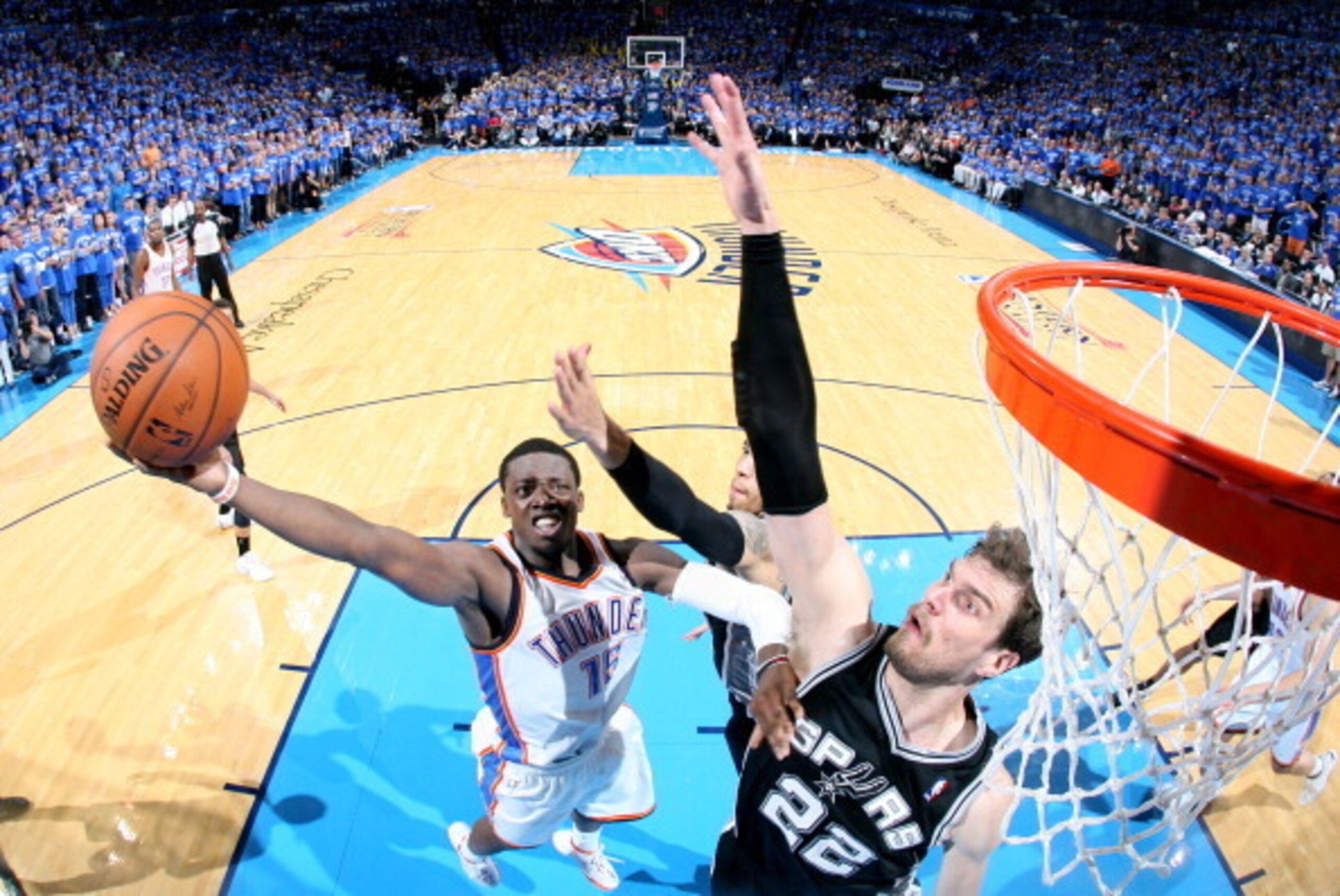 OKLAHOMA CITY, OK  MAY 25: Reggie Jackson #15 of the Oklahoma City Thunder shoots against Tiago Splitter #22 of the San Antonio Spurs in Game Three of the Western Conference Finals during the 2014 NBA Playoffs on May 25, 2014 at the Chesapeake Energy Aren