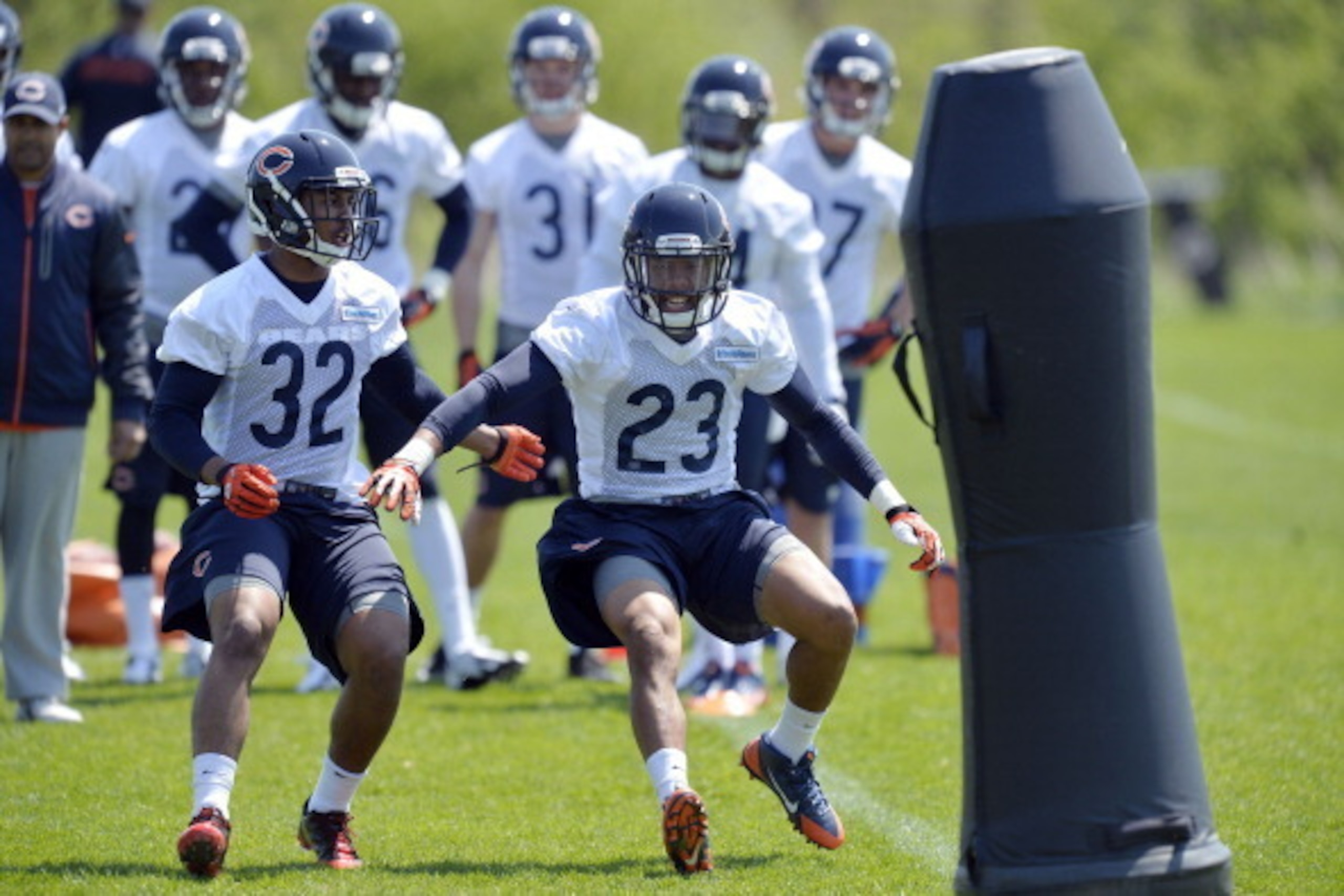 LAKE FOREST, IL - MAY 18:  Cornerback Kyle Fuller #23 and defensive back Ciante Evans #32 of the Chicago Bears work out during rookie minicamp at Halas Hall on May 18, 2014 in Lake Forest, Illinois.   (Photo by Brian Kersey/Getty Images)