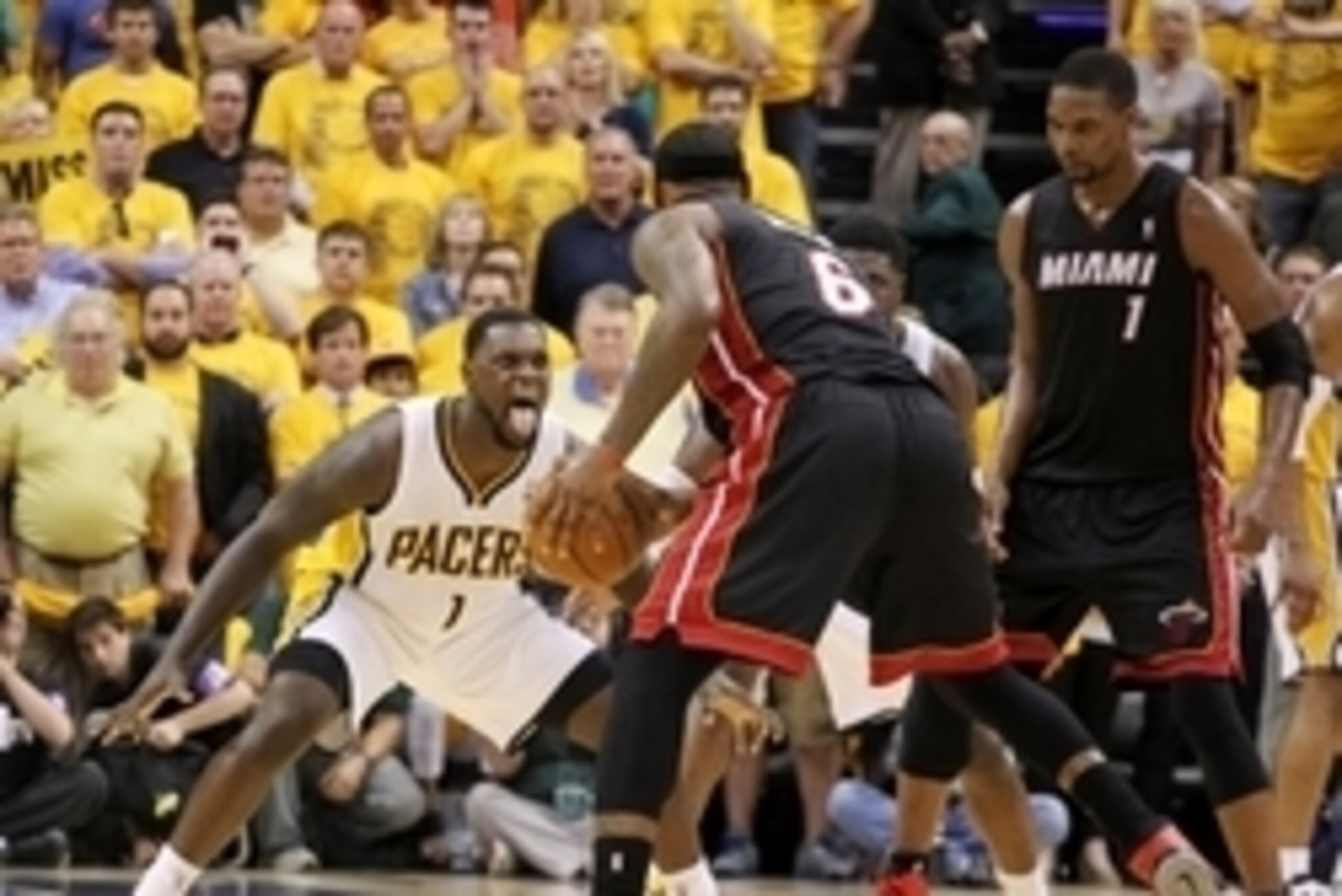May 28, 2014; Indianapolis, IN, USA; Indiana Pacers guard Lance Stephenson (1) guards Miami Heat forward LeBron James (6) during the fourth quarter in game five of the Eastern Conference Finals of the 2014 NBA Playoffs at Bankers Life Fieldhouse.  Indiana