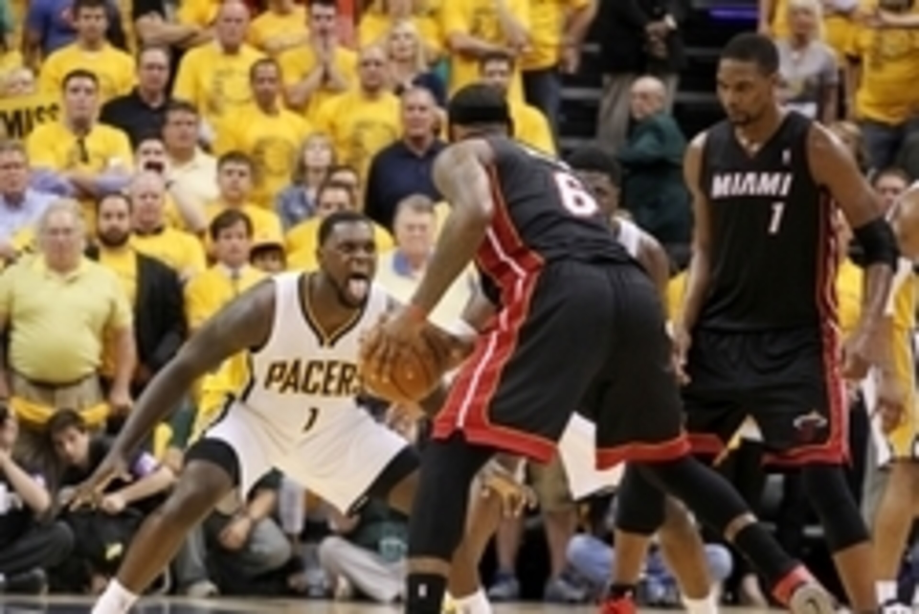 May 28, 2014; Indianapolis, IN, USA; Indiana Pacers guard Lance Stephenson (1) guards Miami Heat forward LeBron James (6) during the fourth quarter in game five of the Eastern Conference Finals of the 2014 NBA Playoffs at Bankers Life Fieldhouse.  Indiana
