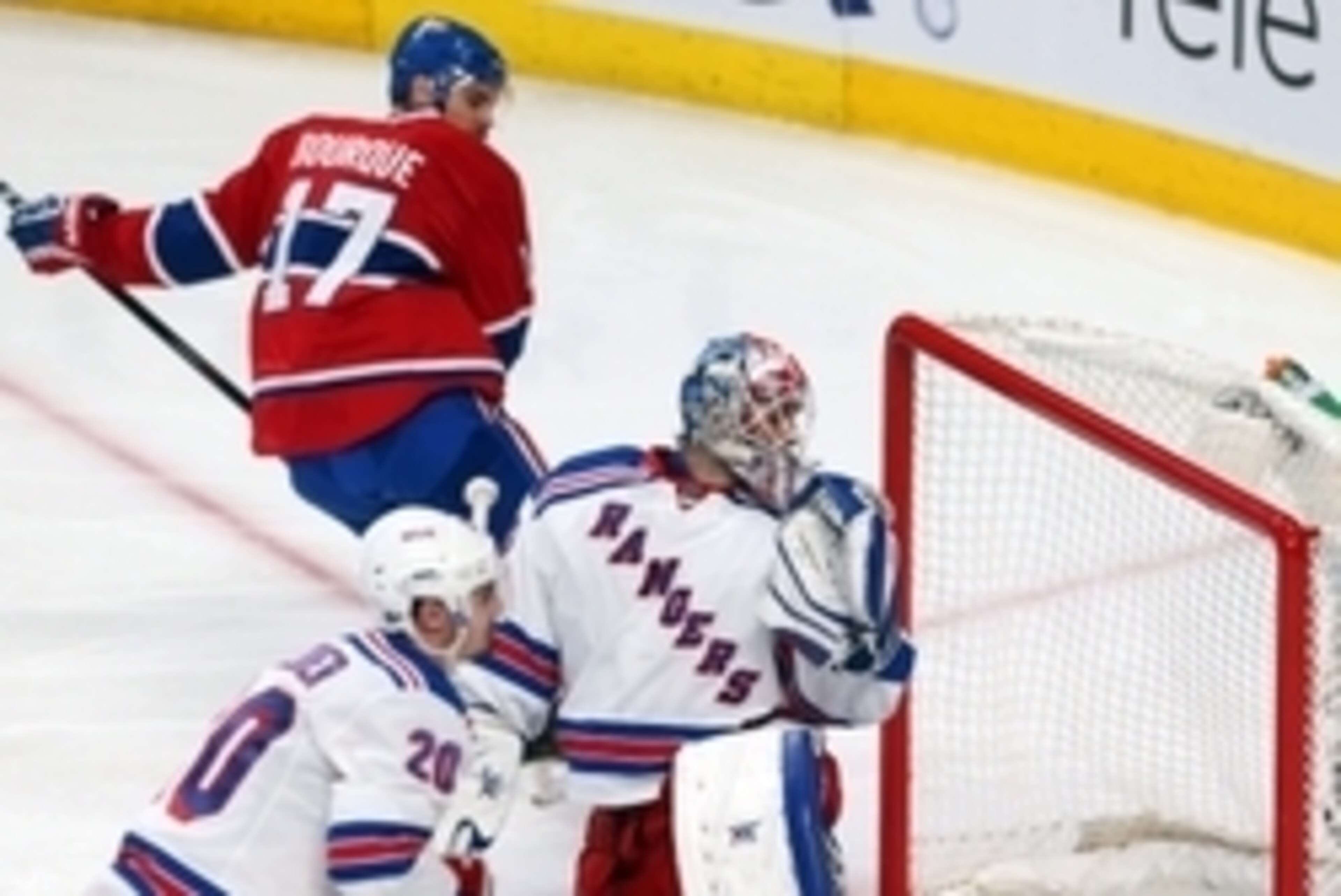 May 27, 2014; Montreal, Quebec, CAN; Montreal Canadiens left wing Rene Bourque (17) scores a goal against New York Rangers goalie Cam Talbot (33) as left wing Chris Kreider (20) passes on during the third period in the game five of the Eastern Conference