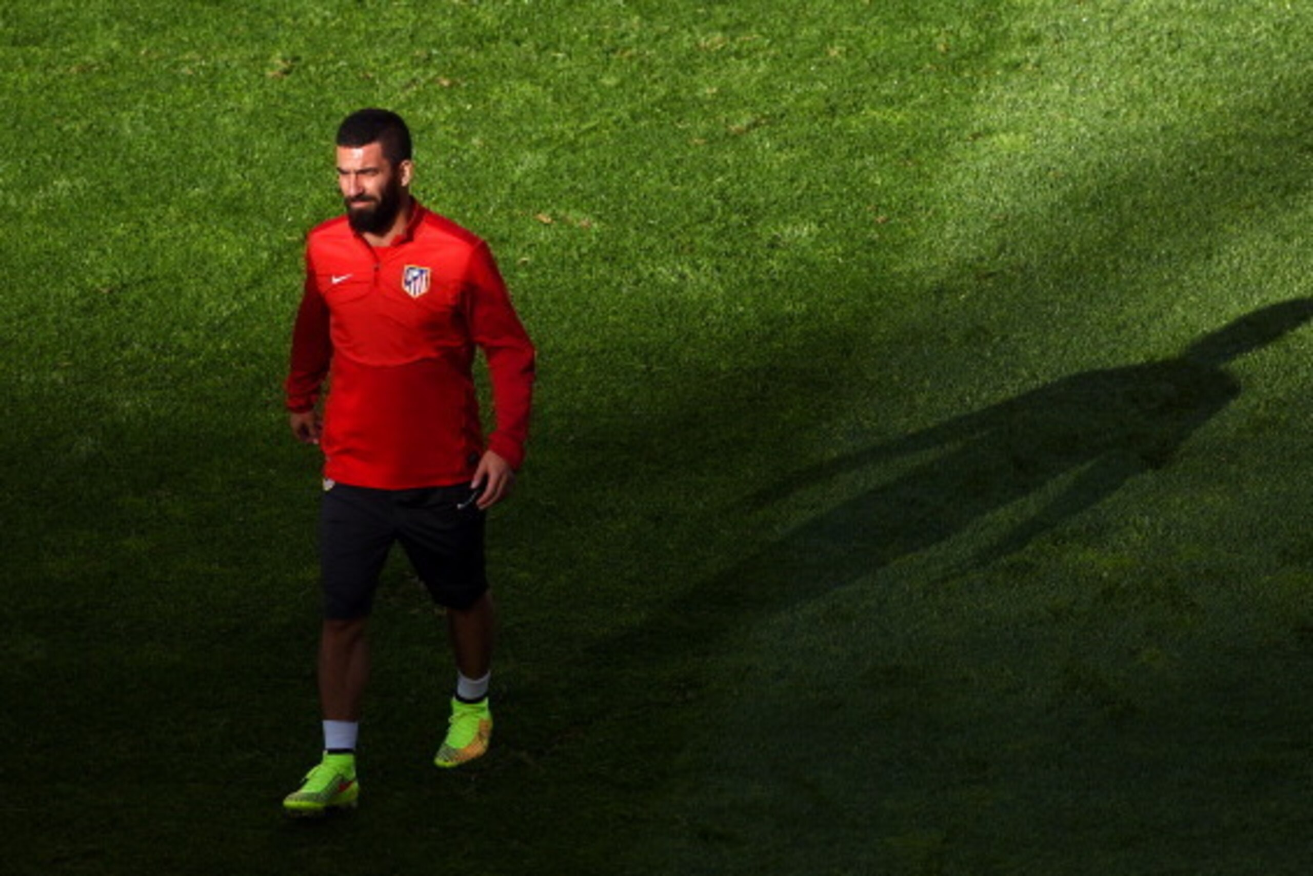 LISBON, PORTUGAL - MAY 23:  Arda Turan of Club Atletico de Madrid looks on during a Club Atletico de Madrid training session ahead of the UEFA Champions League Final against Real Madrid at Estadio da Luz on May 23, 2014 in Lisbon, Portugal.  (Photo by Sha