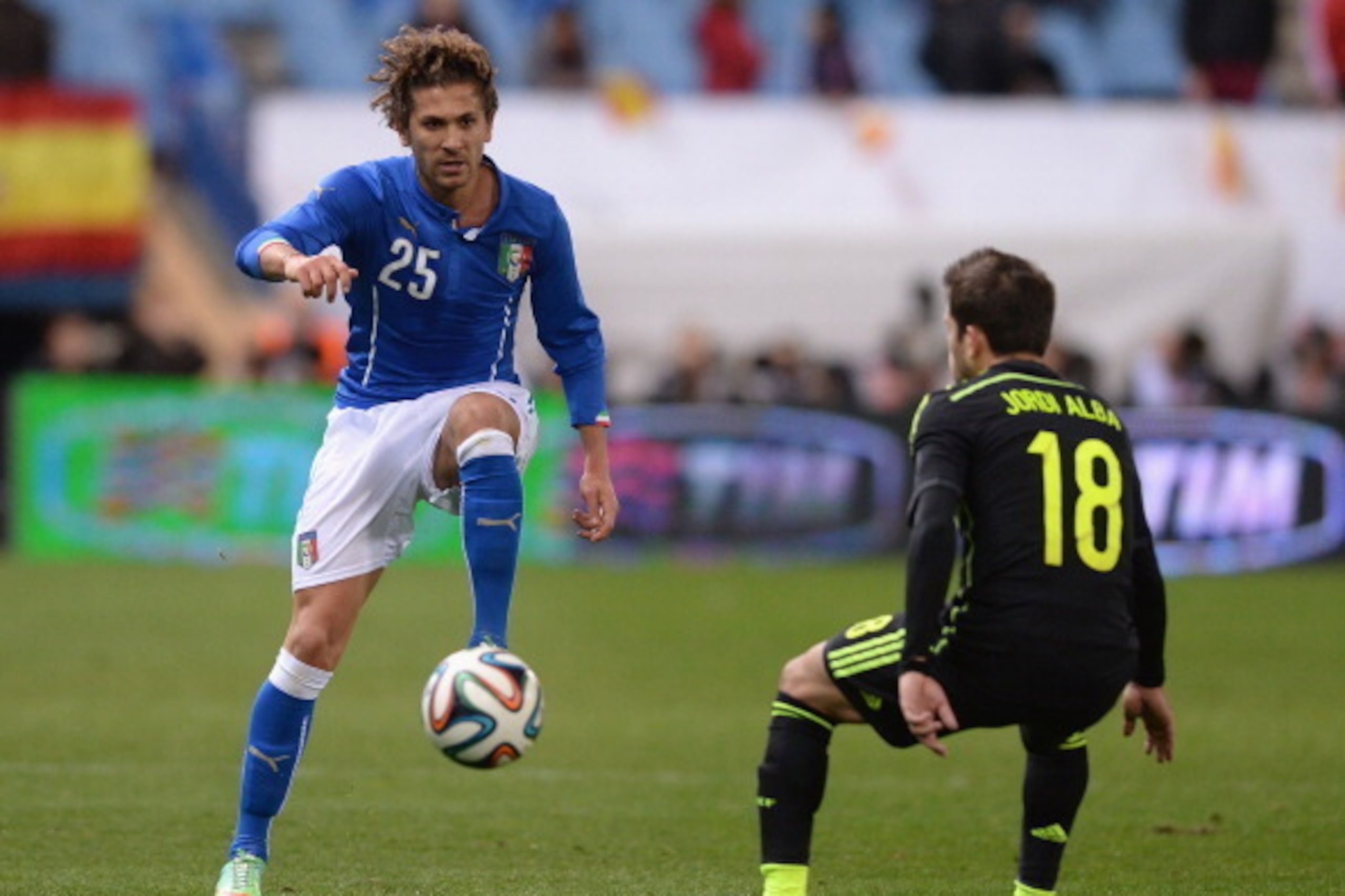 MADRID, SPAIN - MARCH 05:  Alessio Cerci of Italy and Jordi Alba of Spain #18 compete for the ball during the international friendly match between Spain and Italy at Vicente Calderon Stadium on March 5, 2014 in Madrid, Spain.  (Photo by Claudio Villa/Gett