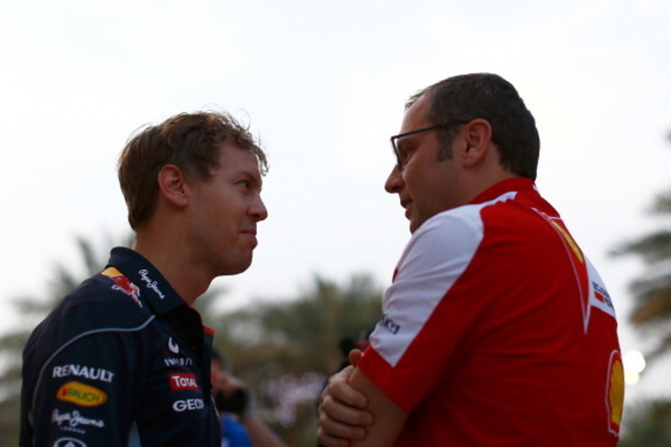 SAKHIR, BAHRAIN - APRIL 20:  Sebastian Vettel of Germany and Infiniti Red Bull Racing speaks with Ferrari team principal Stefano Domenicali after qualifying for the Bahrain Formula One Grand Prix at the Bahrain International Circuit on April 20, 2013 in S