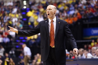 INDIANAPOLIS, IN - MARCH 14:  John Groce the head coach of the Illinois Fighting Illini gives instructions to his team in the game against the  Michigan Wolverines during the Quarterfinals of the Big Ten Basketball Tournament at Bankers Life Fieldhouse on
