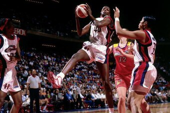 HOUSTON - 1998:  Monica Lamb #40 of the Houston Comets grabs a rebound against the Phoenix Mercury during a WNBA game at the Summit in Houston, Texas. NOTE TO USER: User expressly acknowledges that, by downloading and or using this photograph, User is con