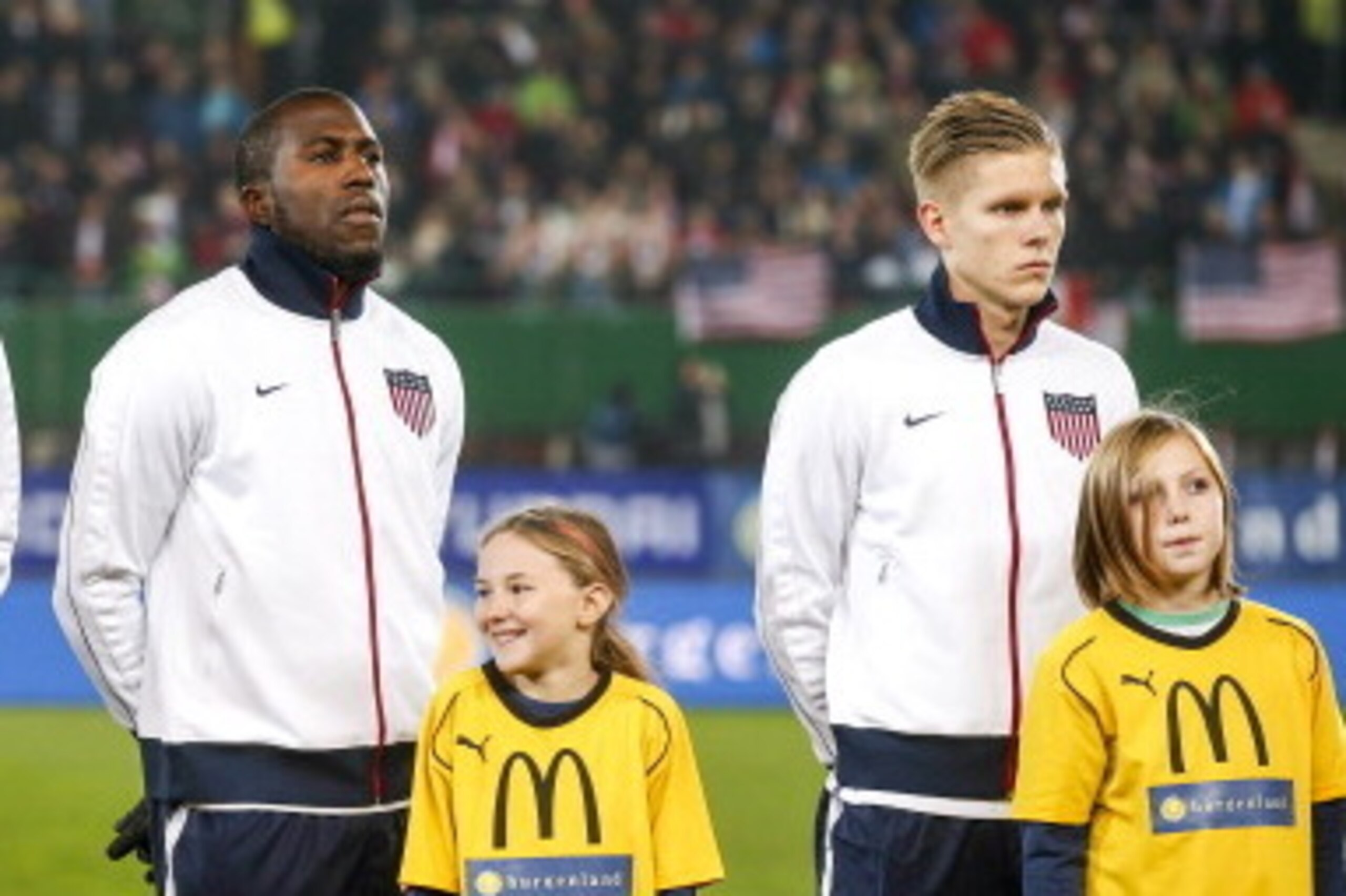 VIENNA, AUSTRIA - NOVEMBER 19:  Brek Shea, Jozy Altidore and Aron Johannsson of USA (L-R) line up for the national anthem prior to the International friendly match between Austria and USA at the Ernst-Happel Stadium on November 19, 2013 in Vienna, Austria